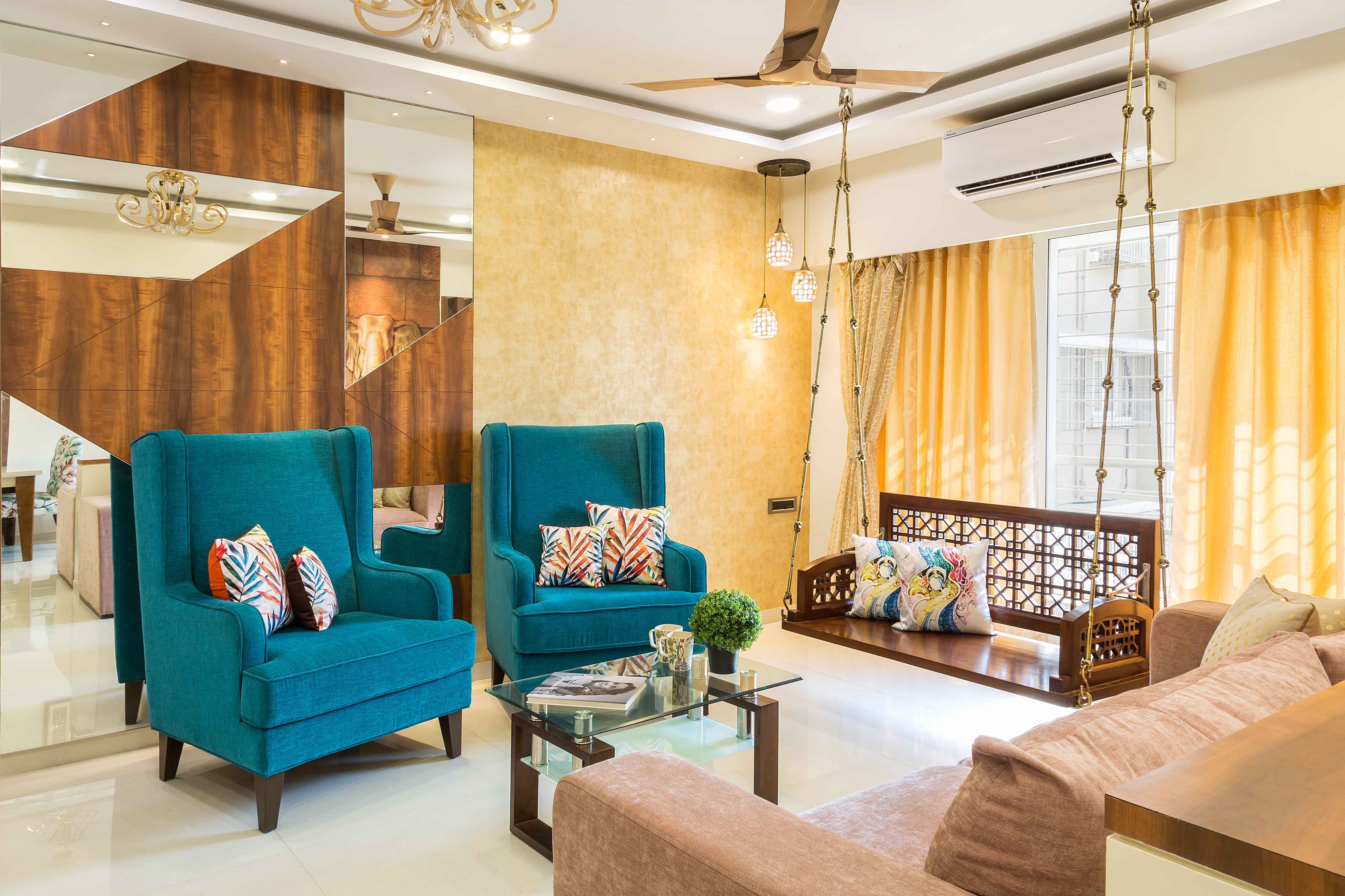 Multi-coloured living room design with glass wall panel and yellow wall paint - Livspace