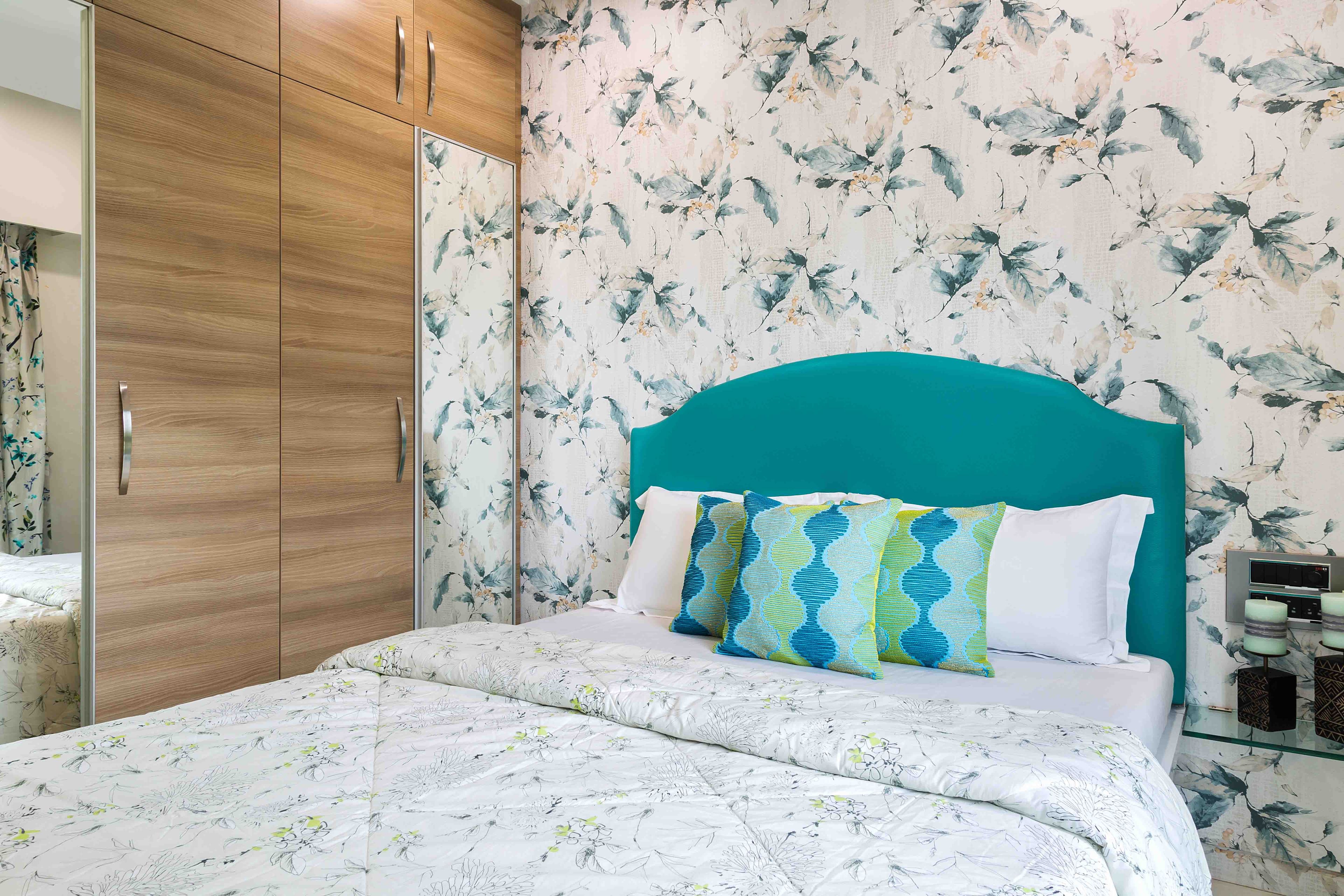 Kid's room design with mirrored wooden wardrobe and bue headboard - Livspace