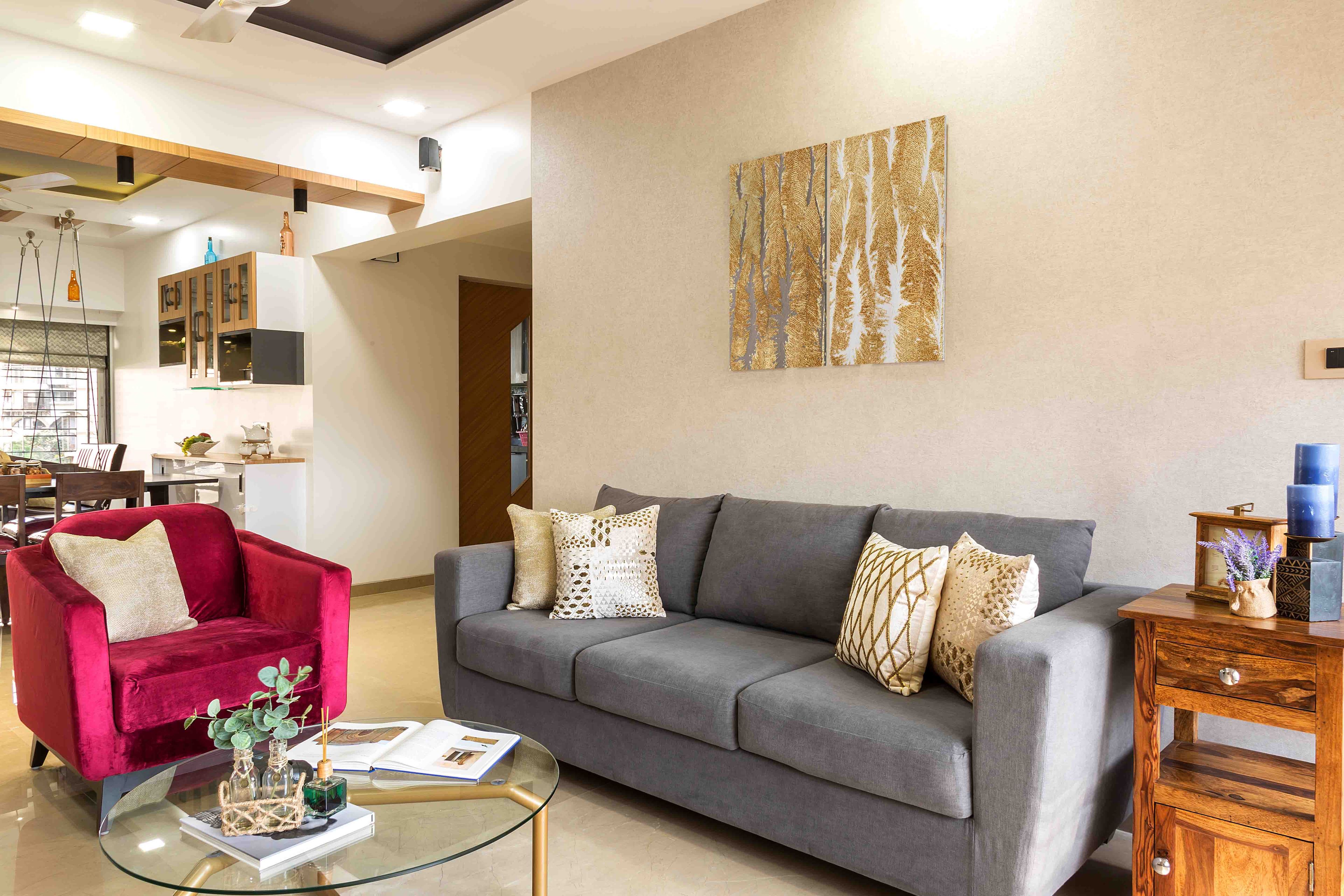 Grey and pink living room design with velvet upholstered furniture - Livspace