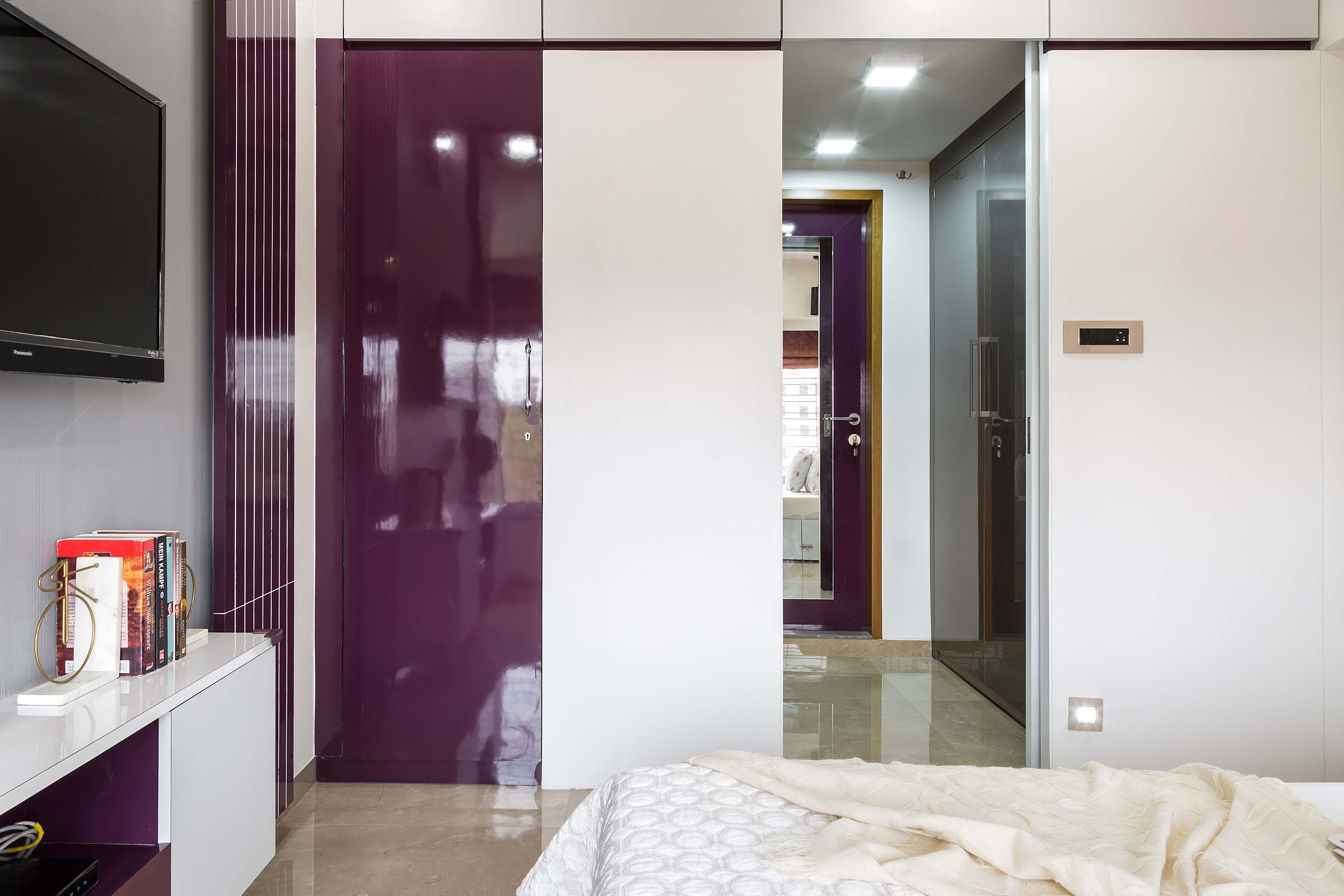White and purple swing wardrobe design with walk-in wardrobe - Livspace