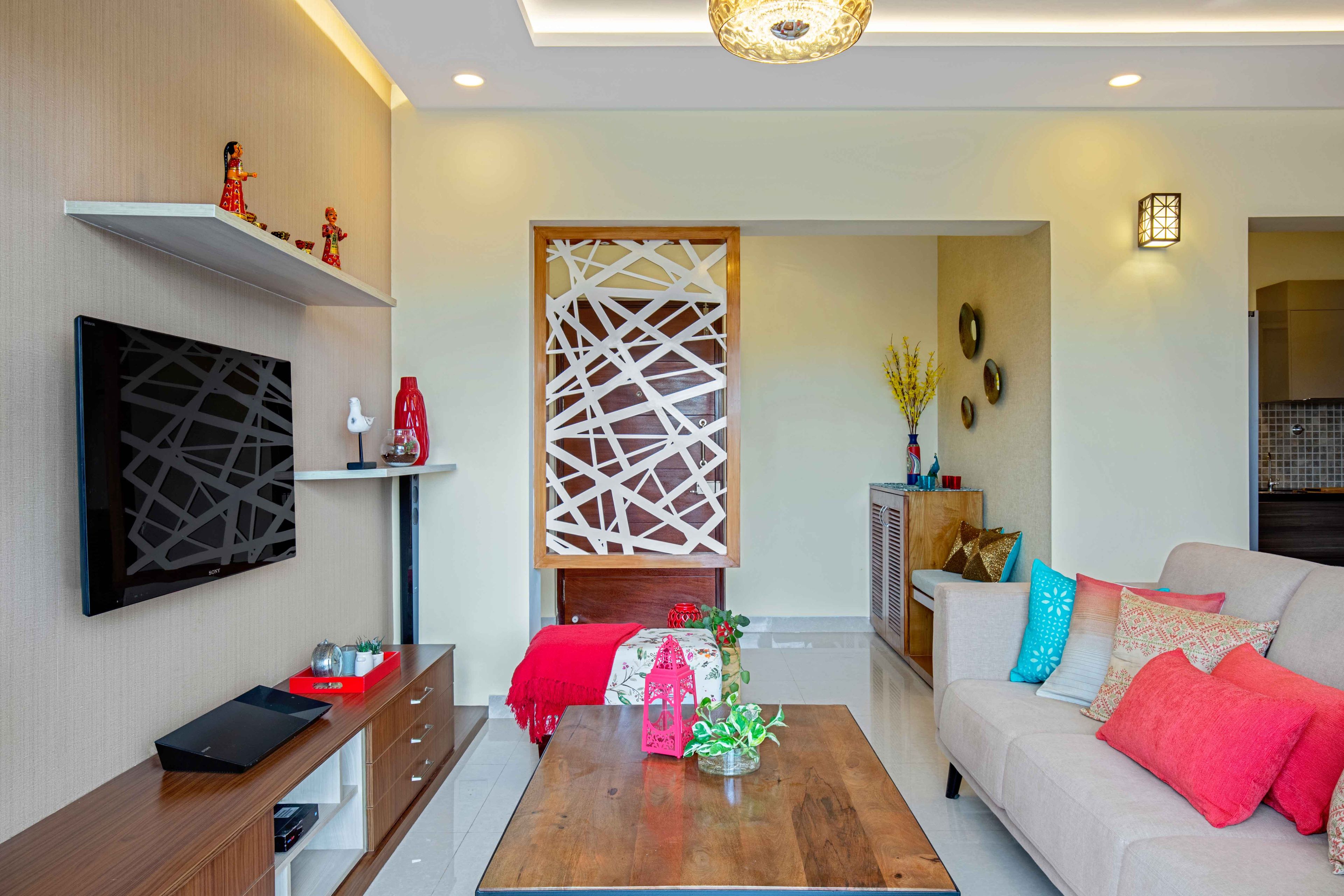 Living room design with white abstract partition - Livspace