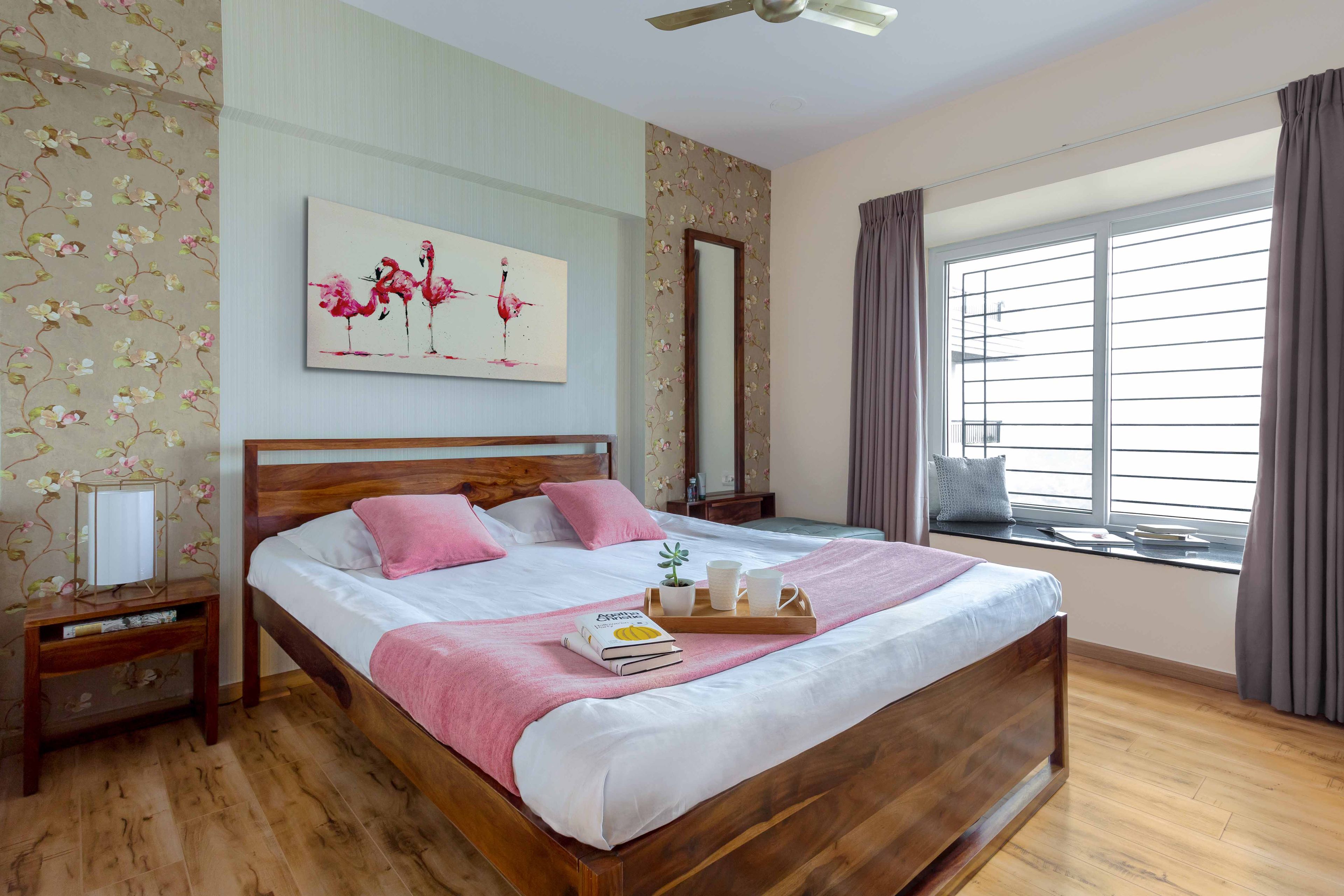 White and pink master bedroom design with floral side wallpaper - Livspace