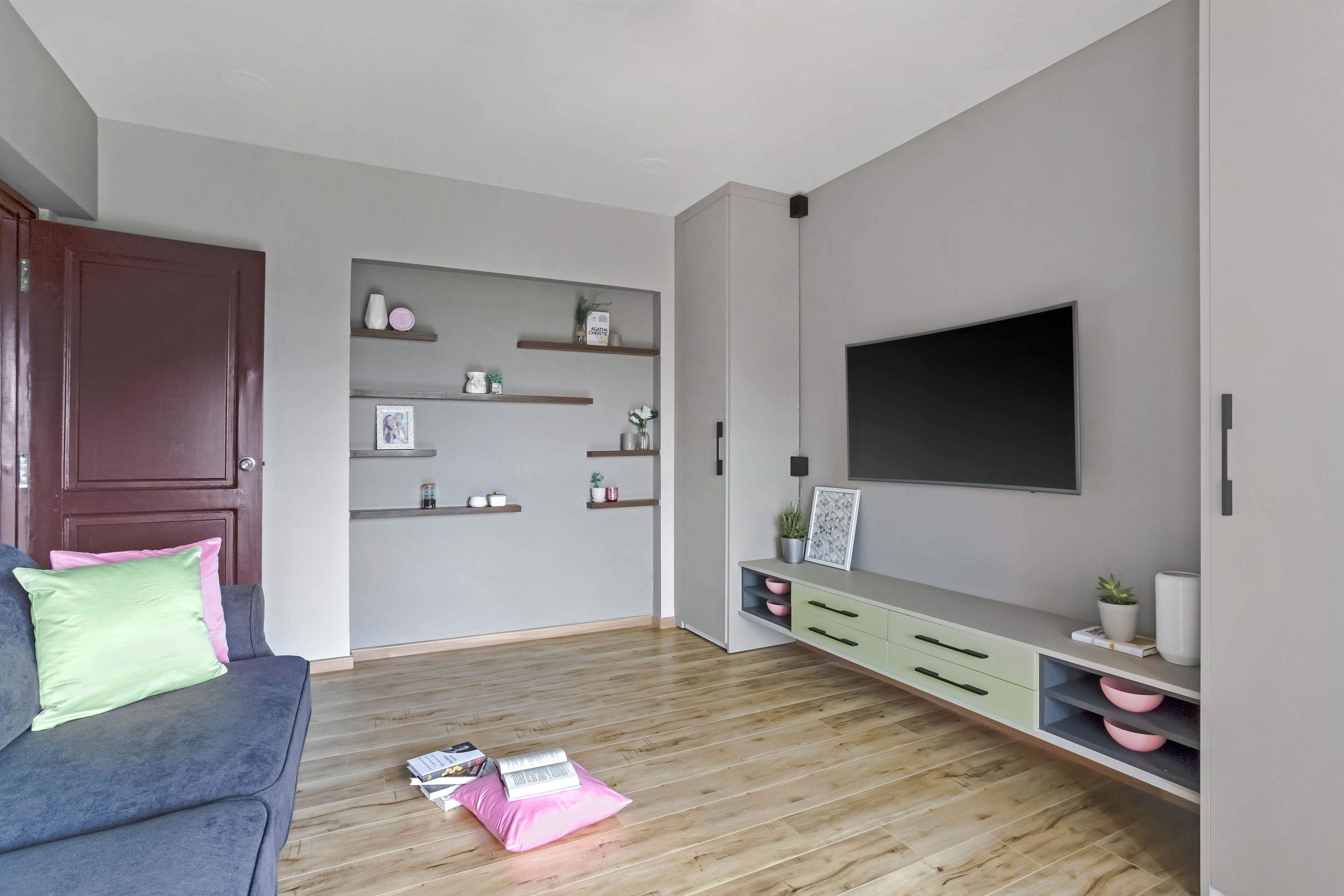 Grey family room design with TV unit and grey accent walls - Livspace