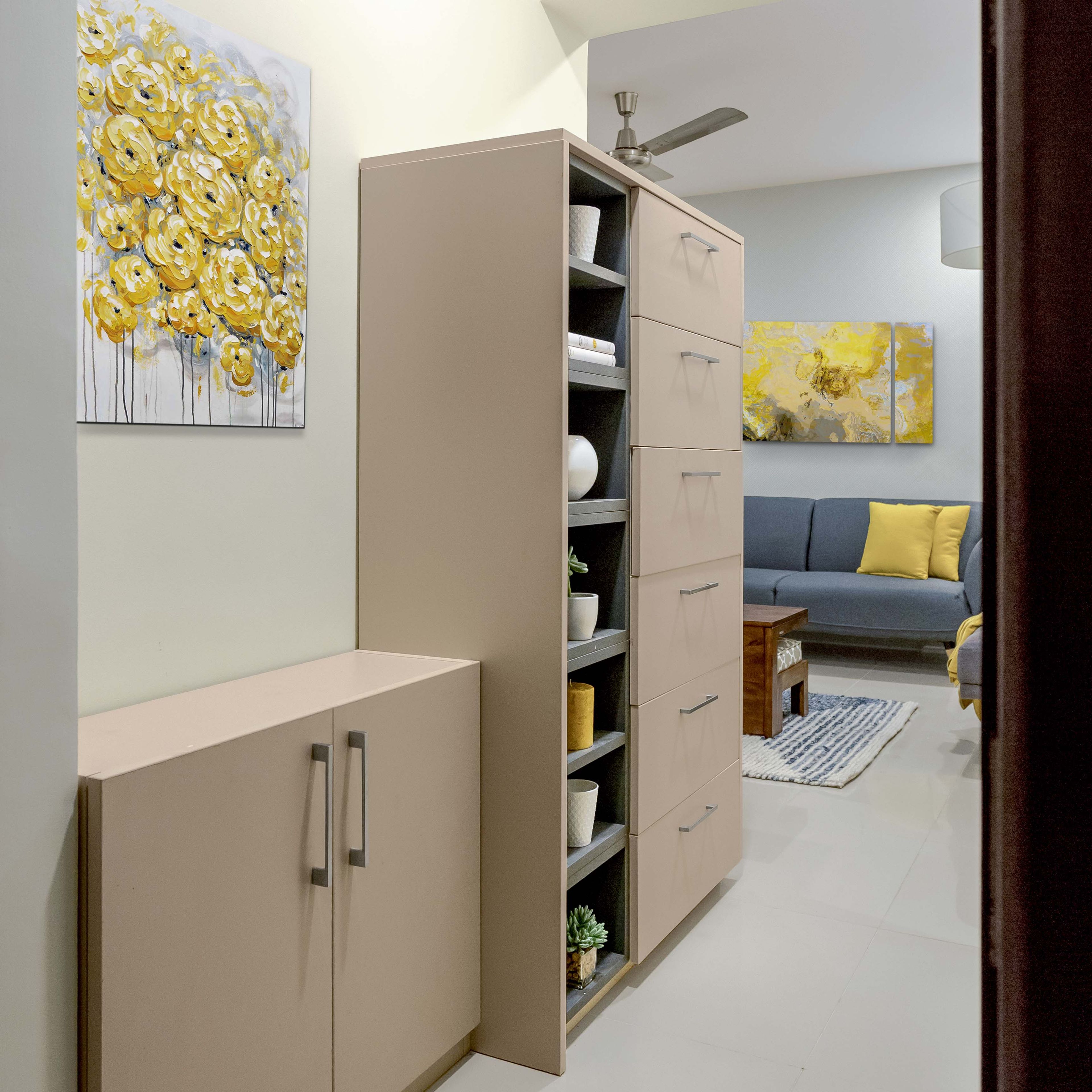 Compact foyer design with beige storage - Livspace