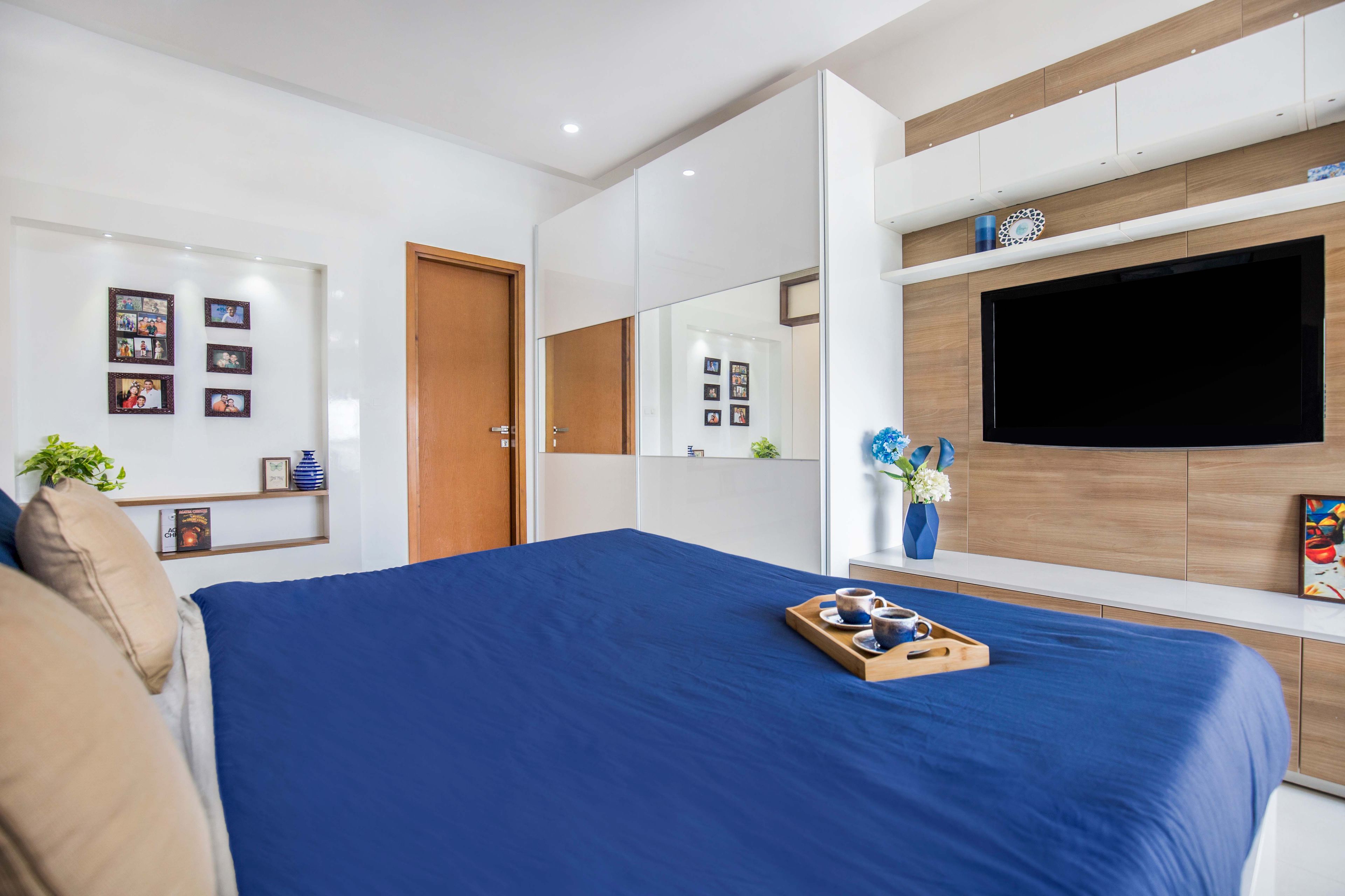 White mirrored sliding wardrobe design - Livspace