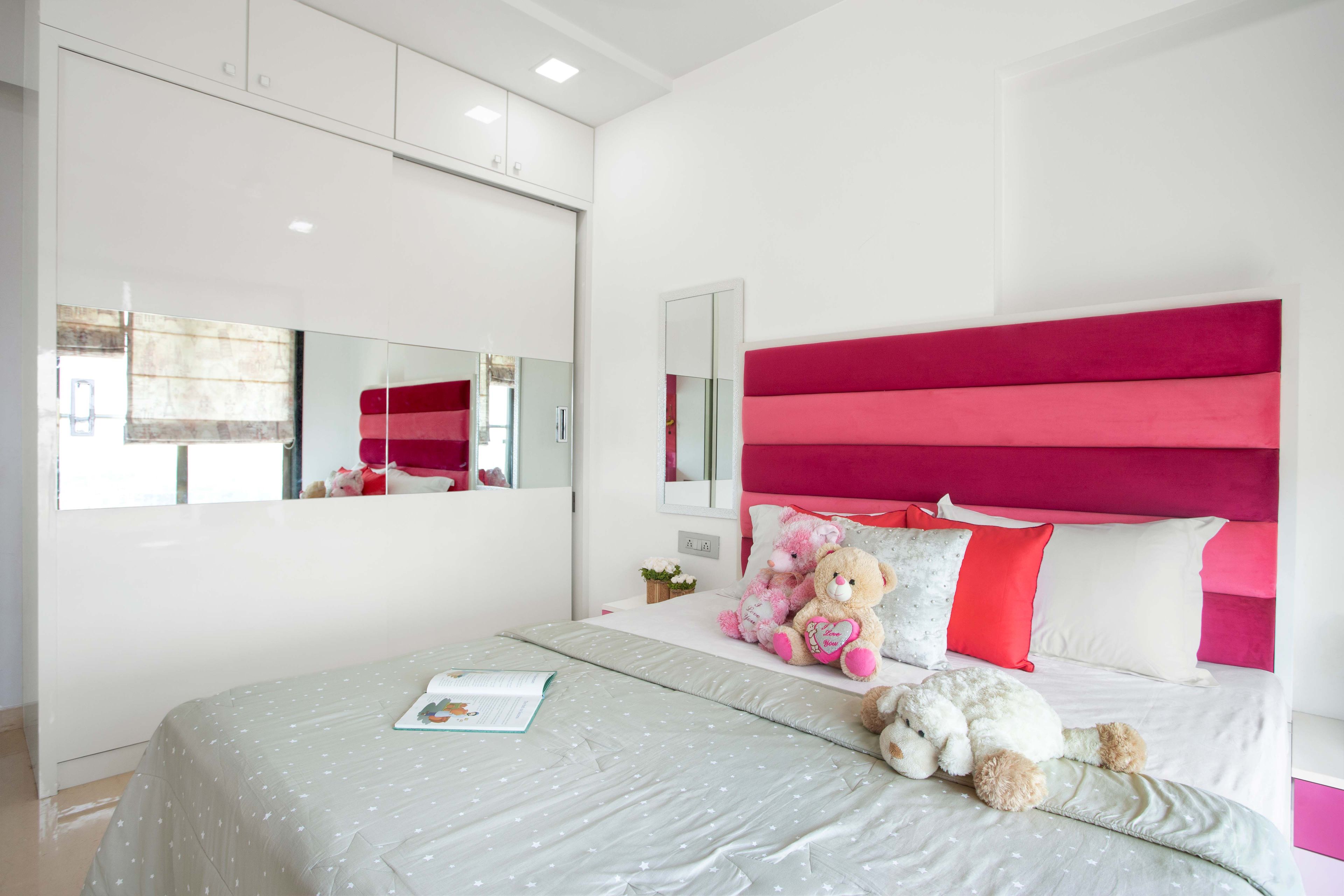 White and pink kids bedroom design with pink tufted headboard - Livspace