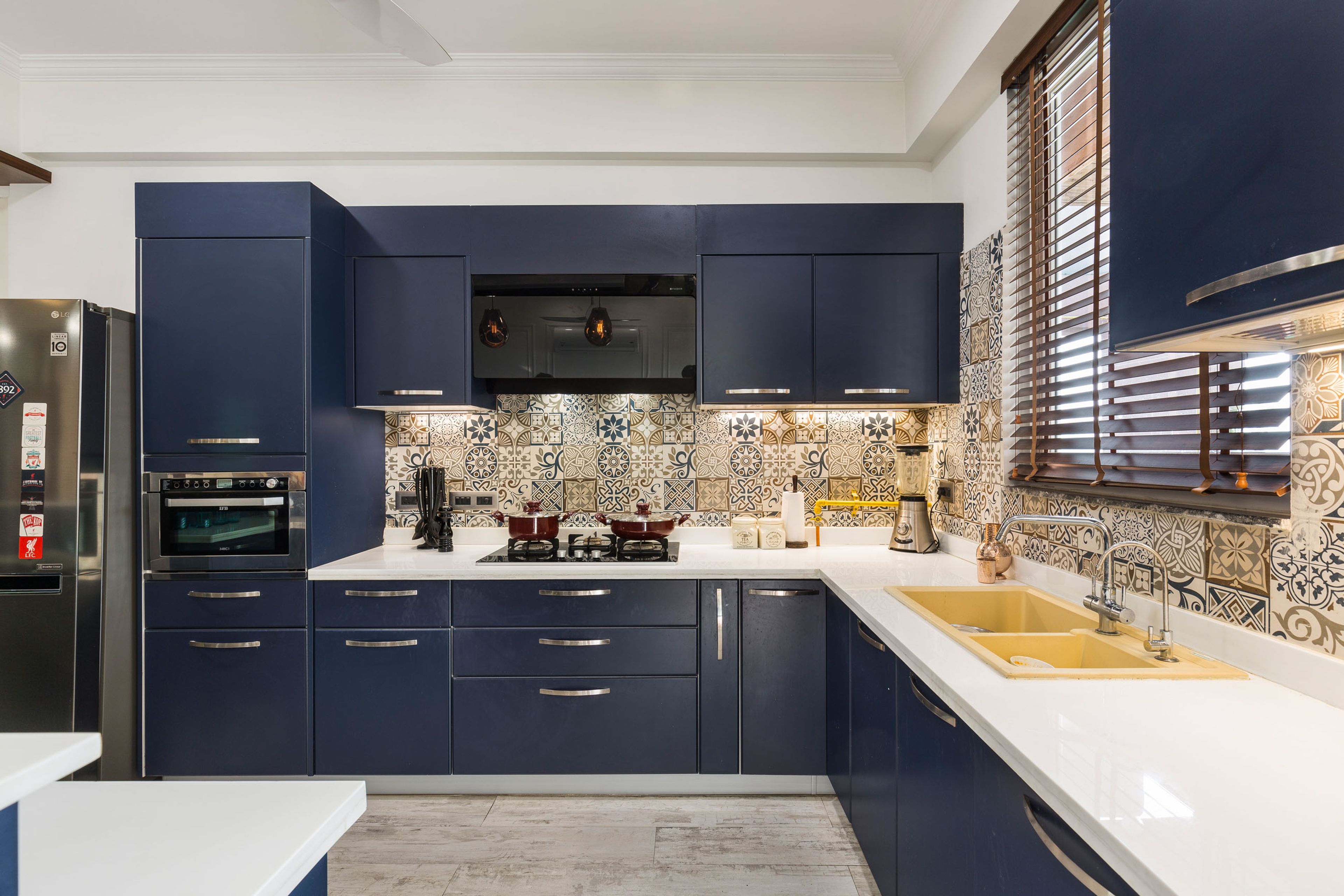 Modern L-Shape Modular Kitchen Design With Wave Blue Cabinets and Quartz Countertop