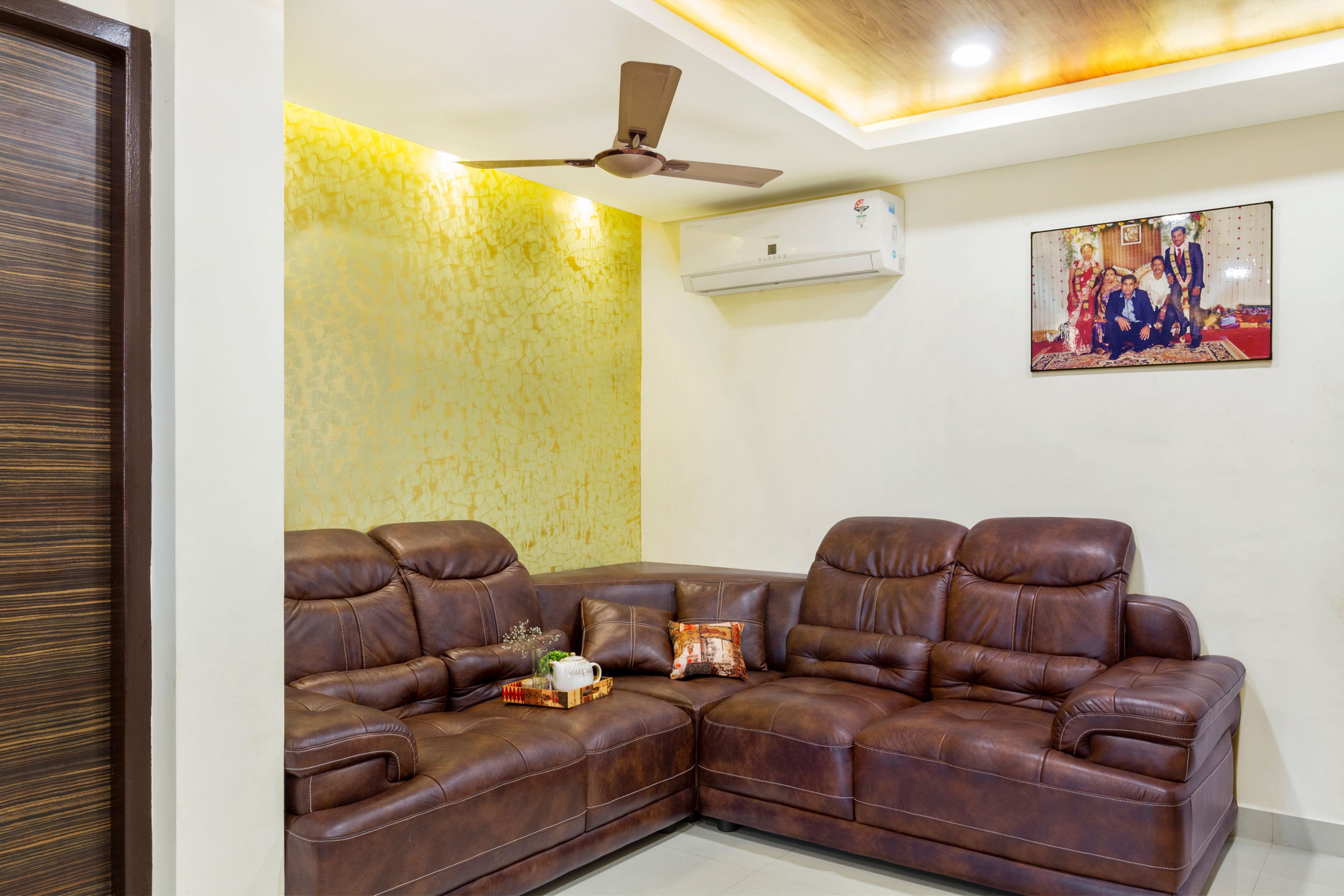 8x8 Ft Compact Living Room Design With Brown Leather Sofa - Livspace