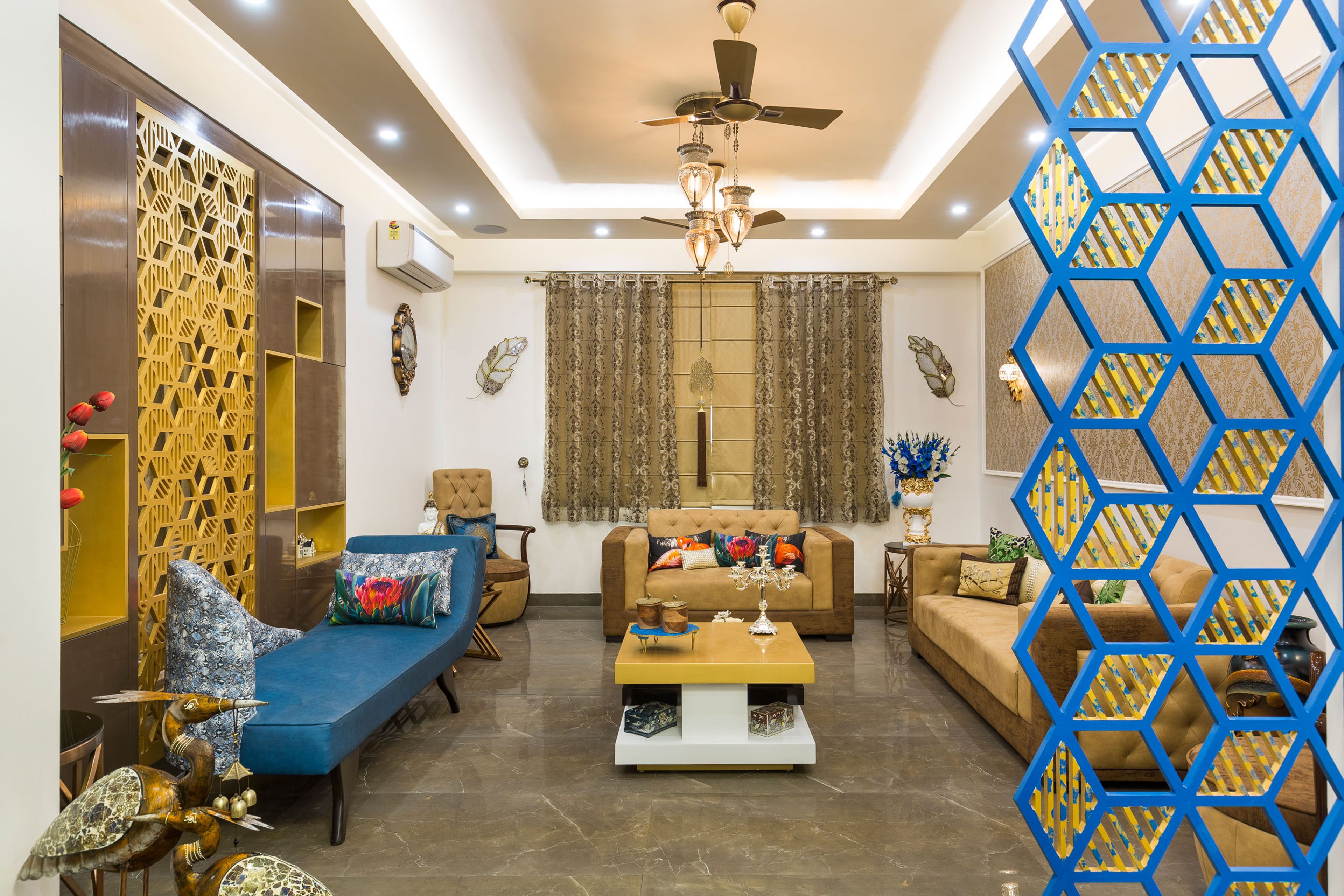 13x10 Ft Gold-Toned Living Room Design With Beige And Brown Sofas And Damask Wallpaper - Livspace