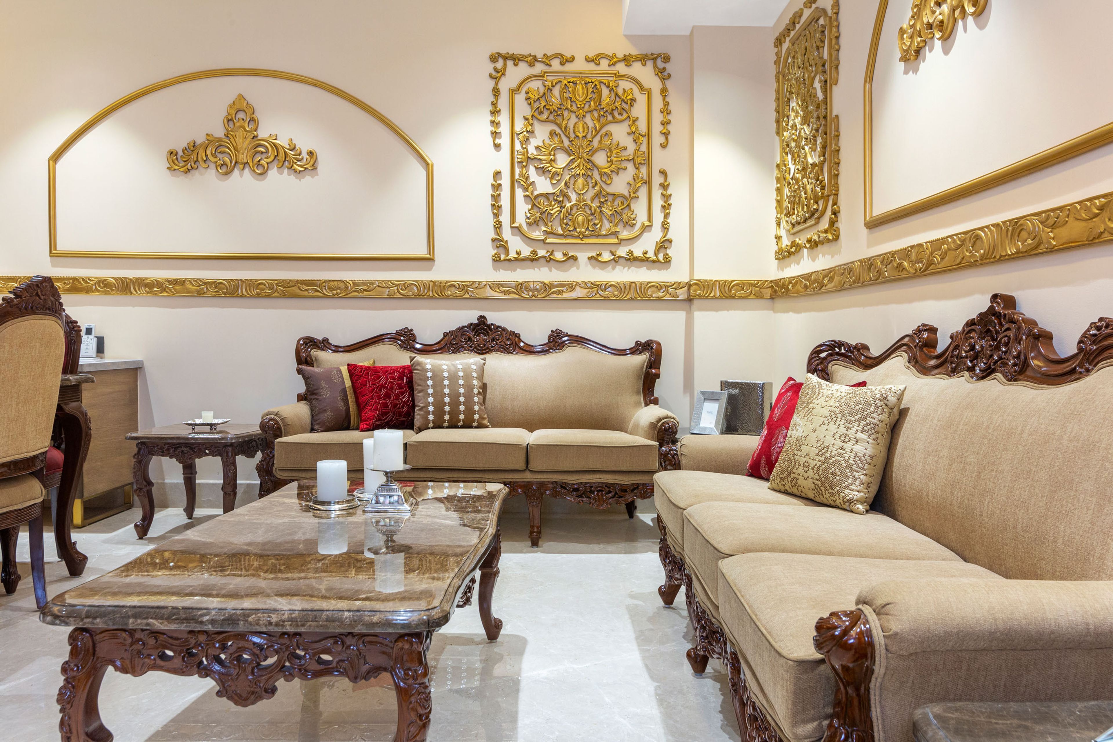 12x10 Ft Living Room Design With Ornamental Gold-Toned Wall Moulding - Livspace
