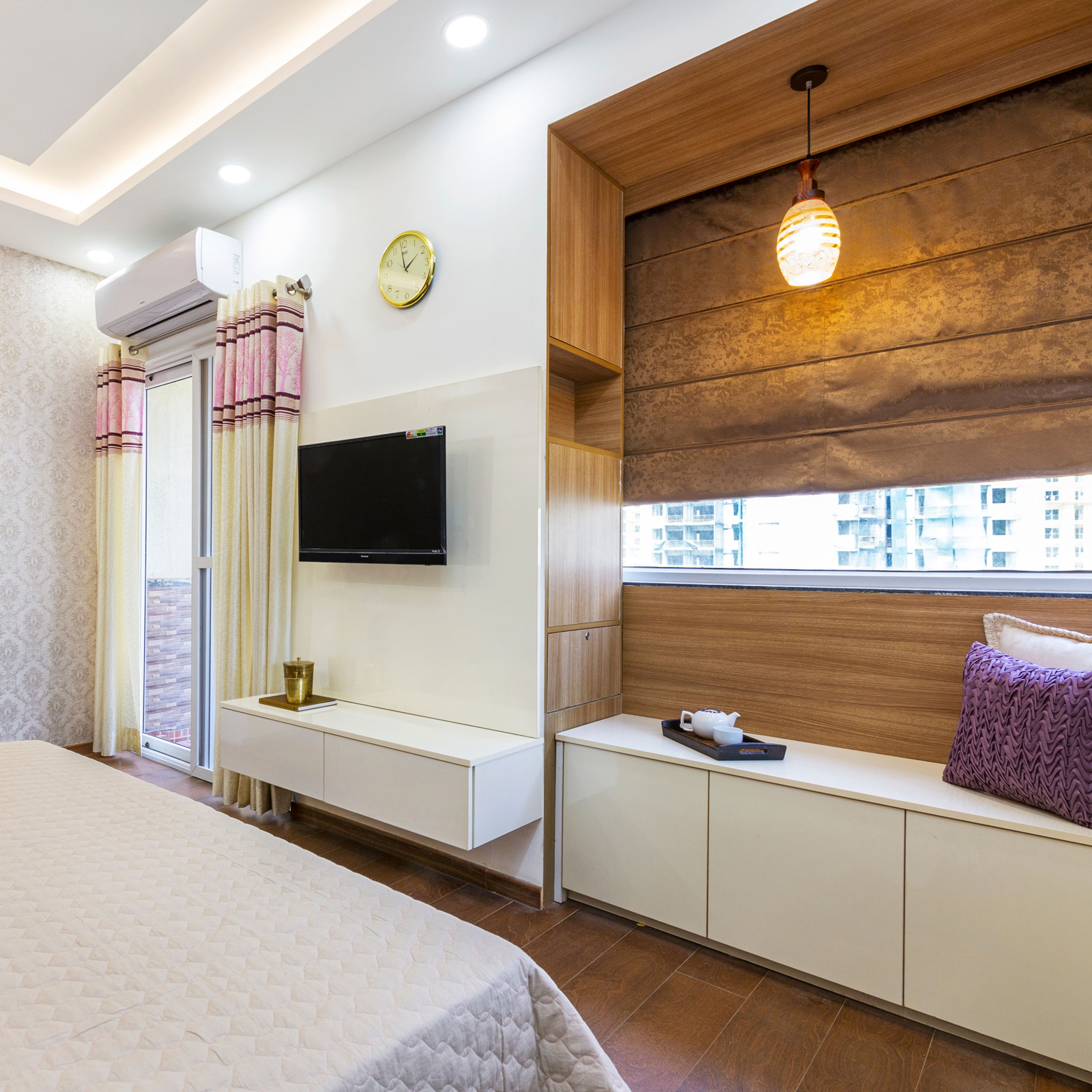 Champagne-Toned Wall-Mounted TV Unit Design - Livspace