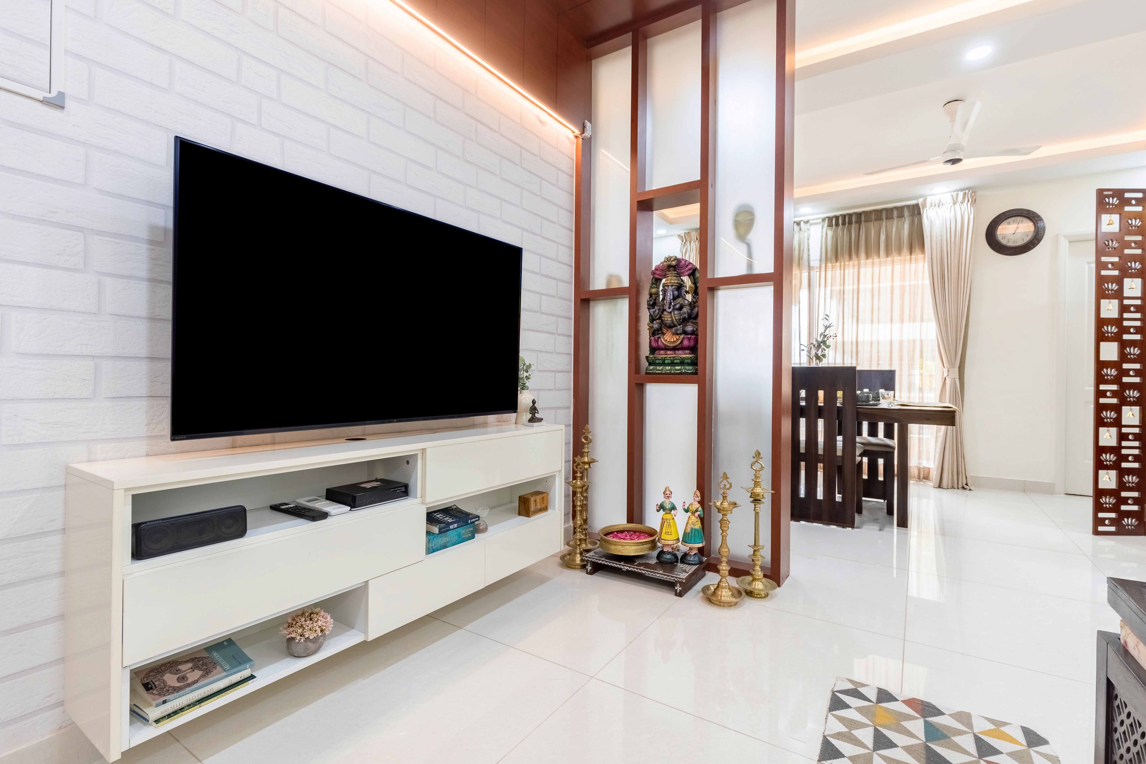 Frosty White TV Unit Design With White Brick Wallpaper - Livspace