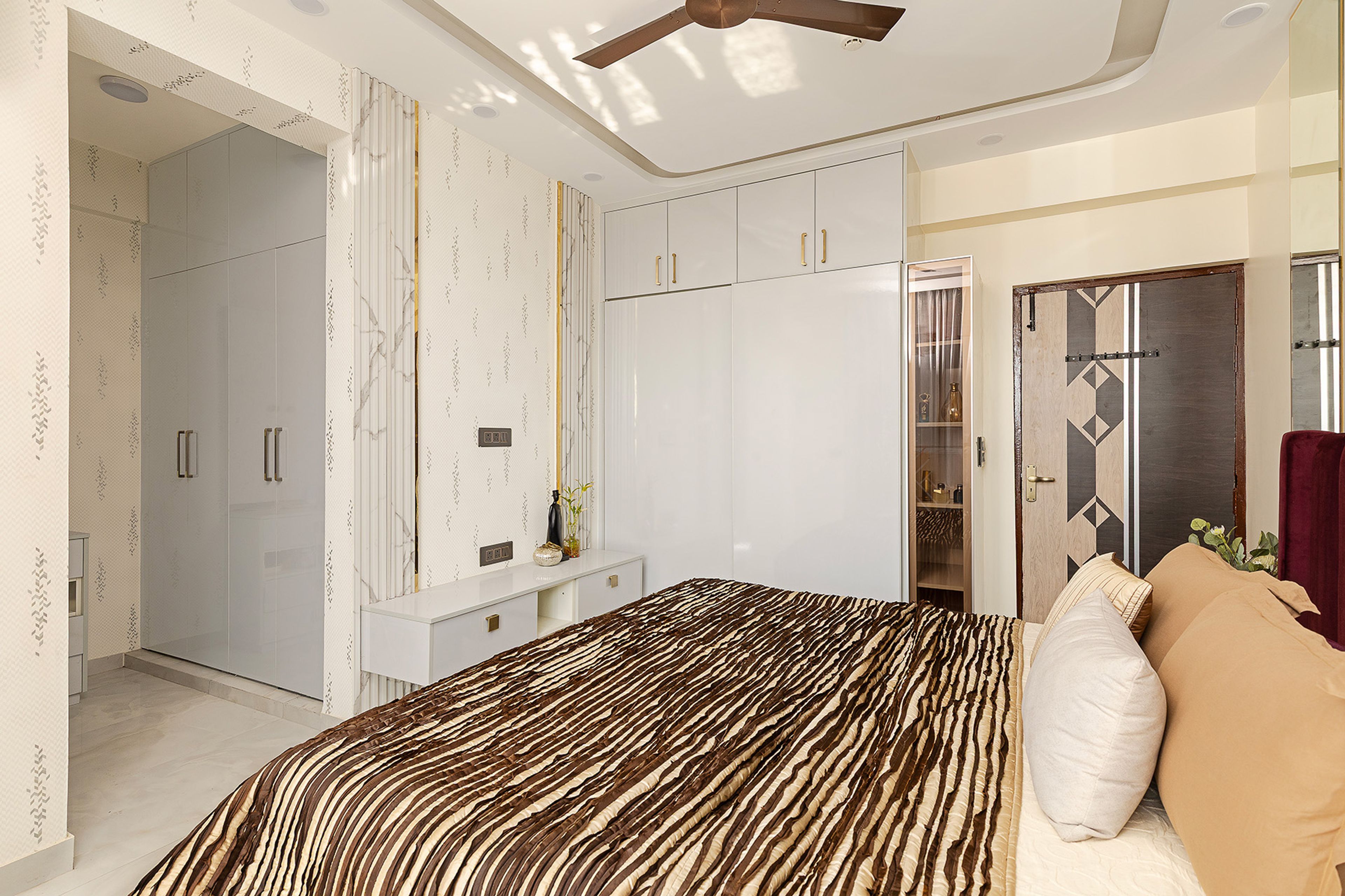 Master Bedroom Design with Velvet Headboard Bed, Floating White Consoles and Wardrobe