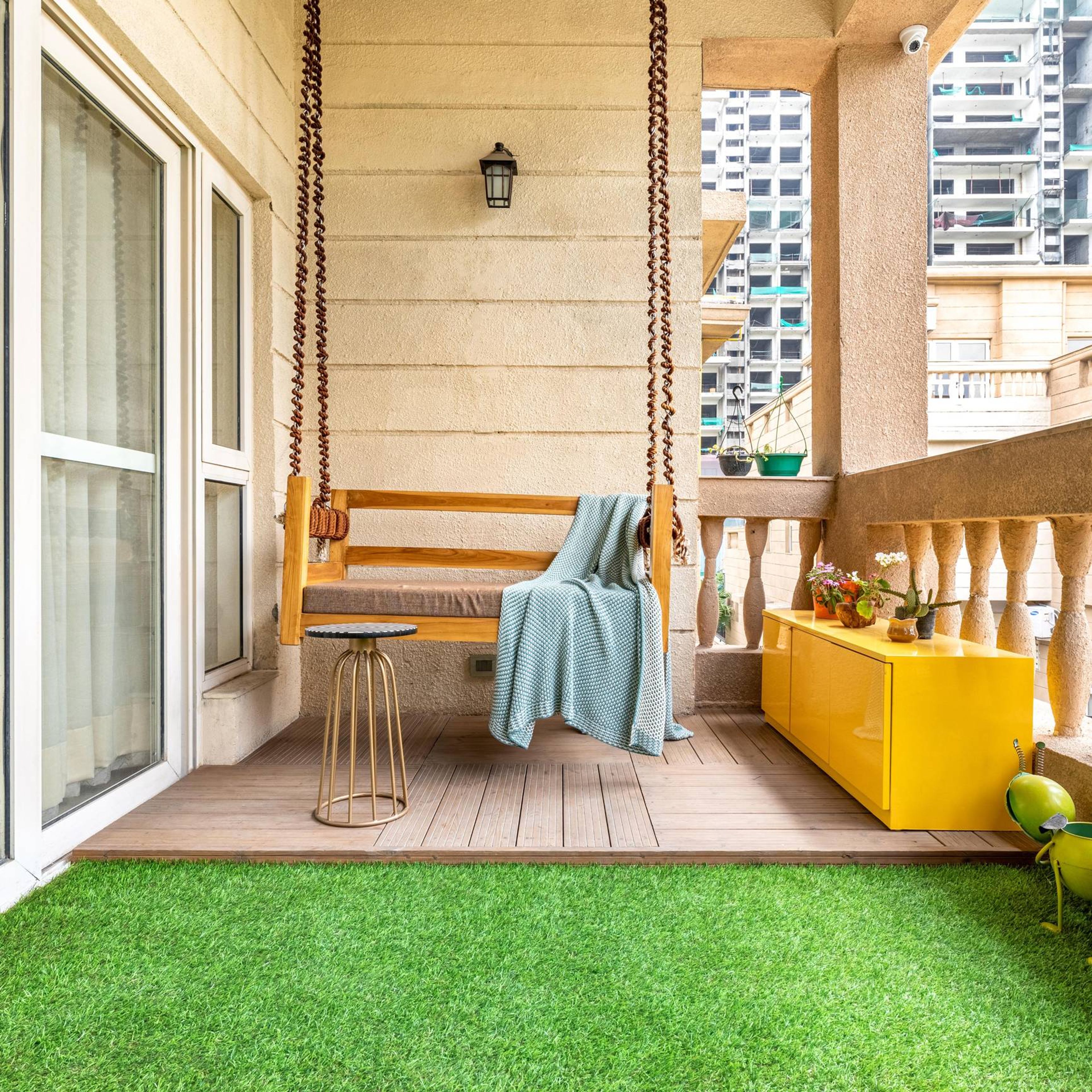 Modern Balcony Design With Wooden And Artifical Grass Flooring