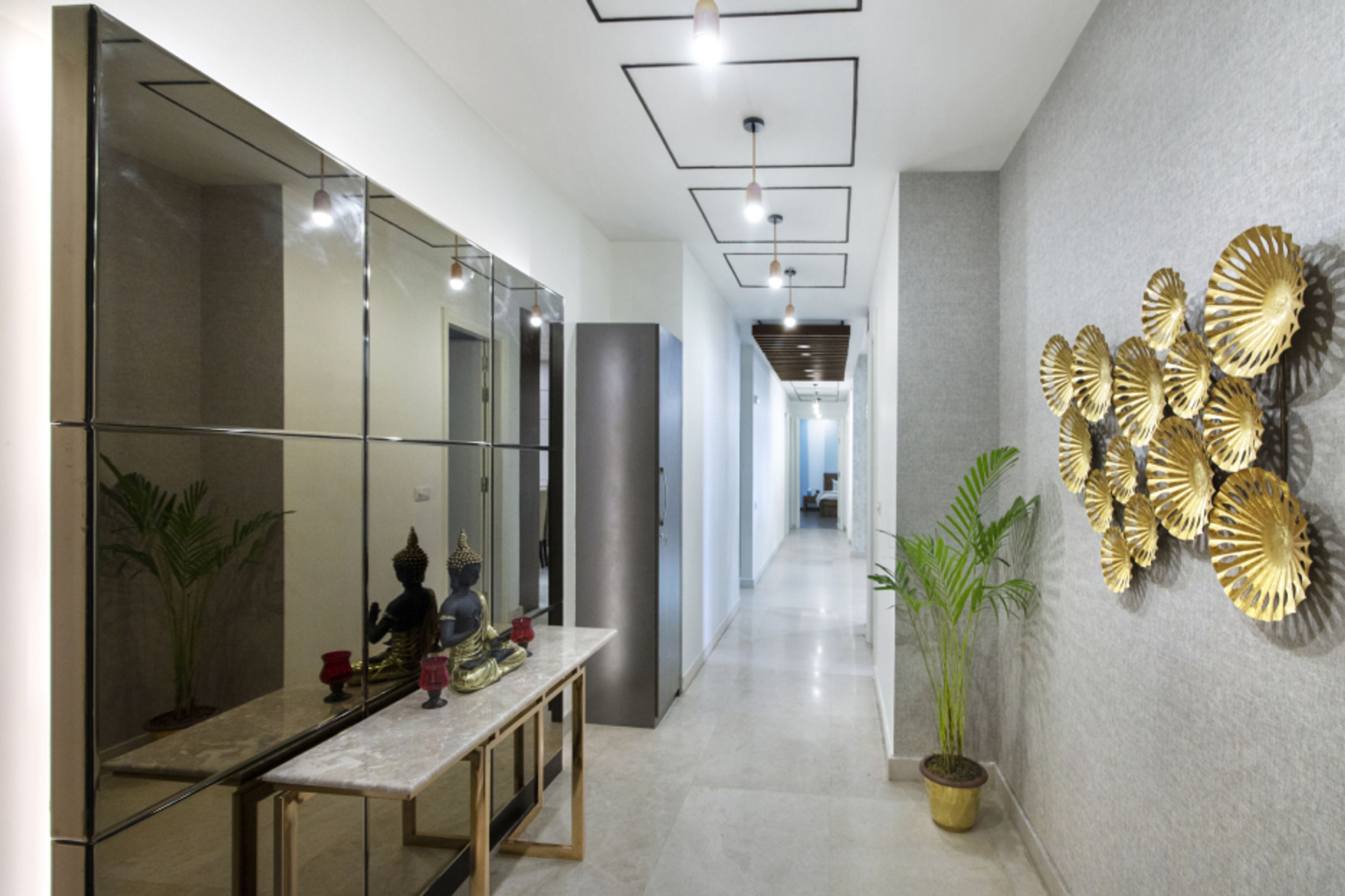 Modern Cream And Gold Foyer Design With Glossy Panelling