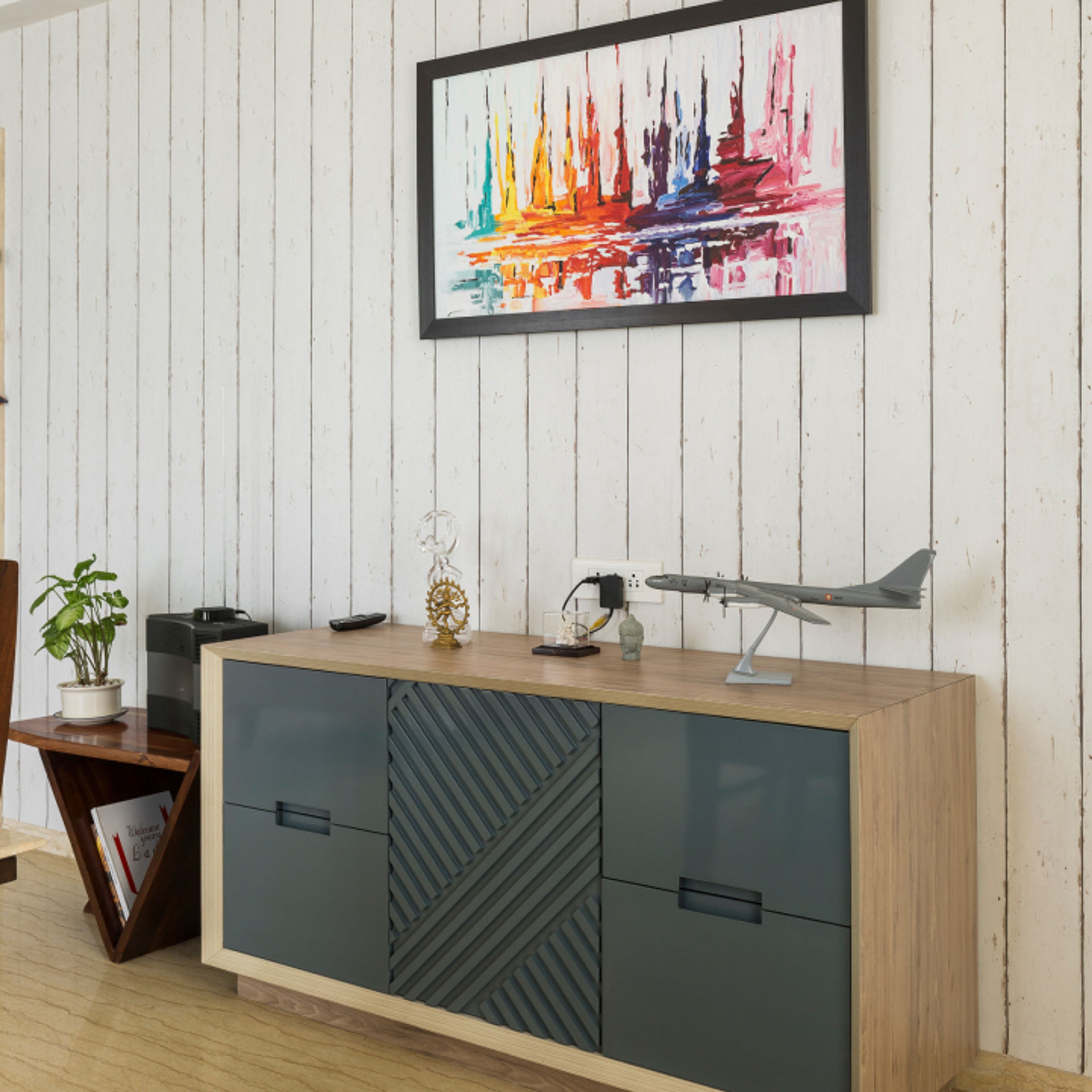 Modern Foyer Design With Striped Accent Wall And Dual-Toned Storage