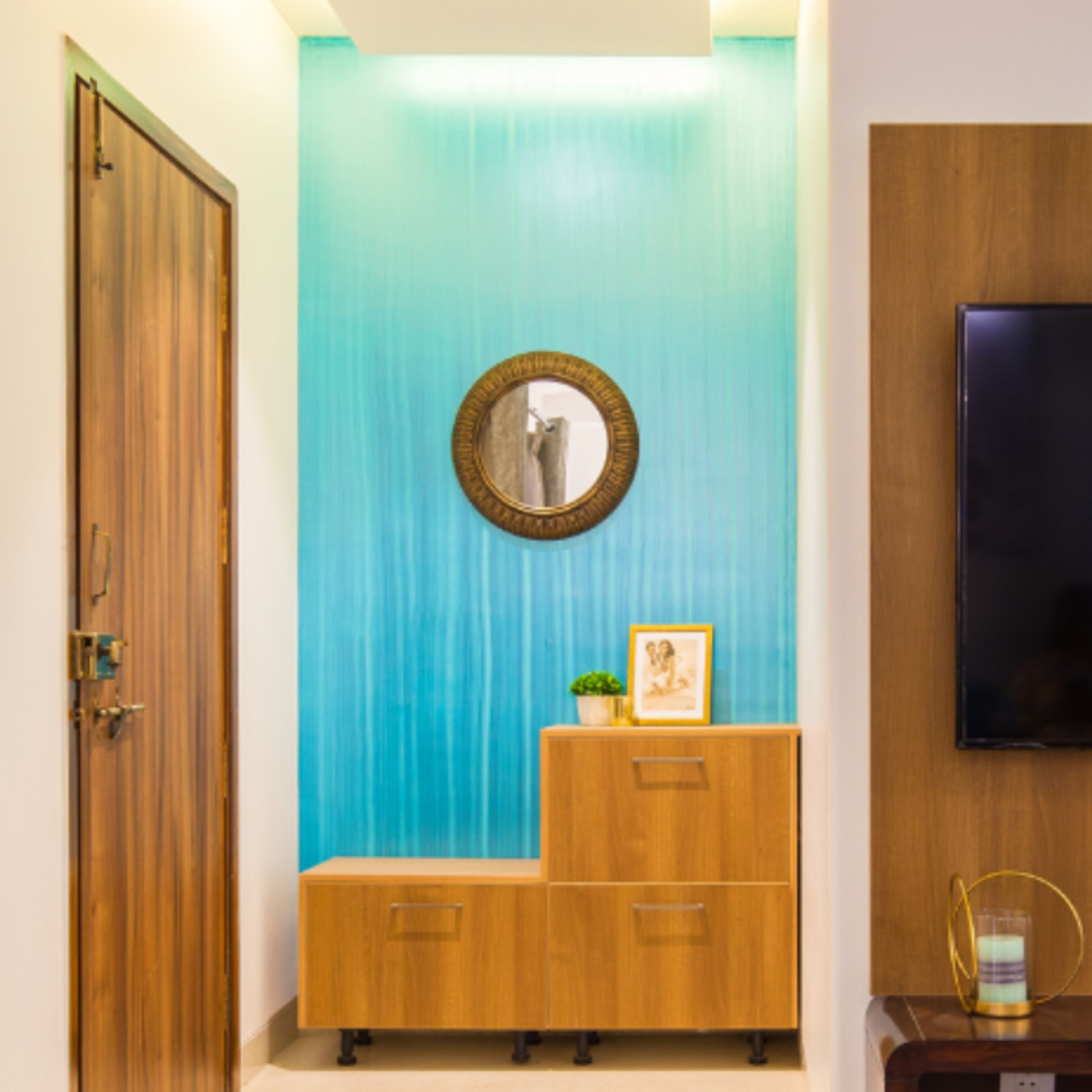 Classic Foyer Design With Light Blue Wallpaper And Brown Storage