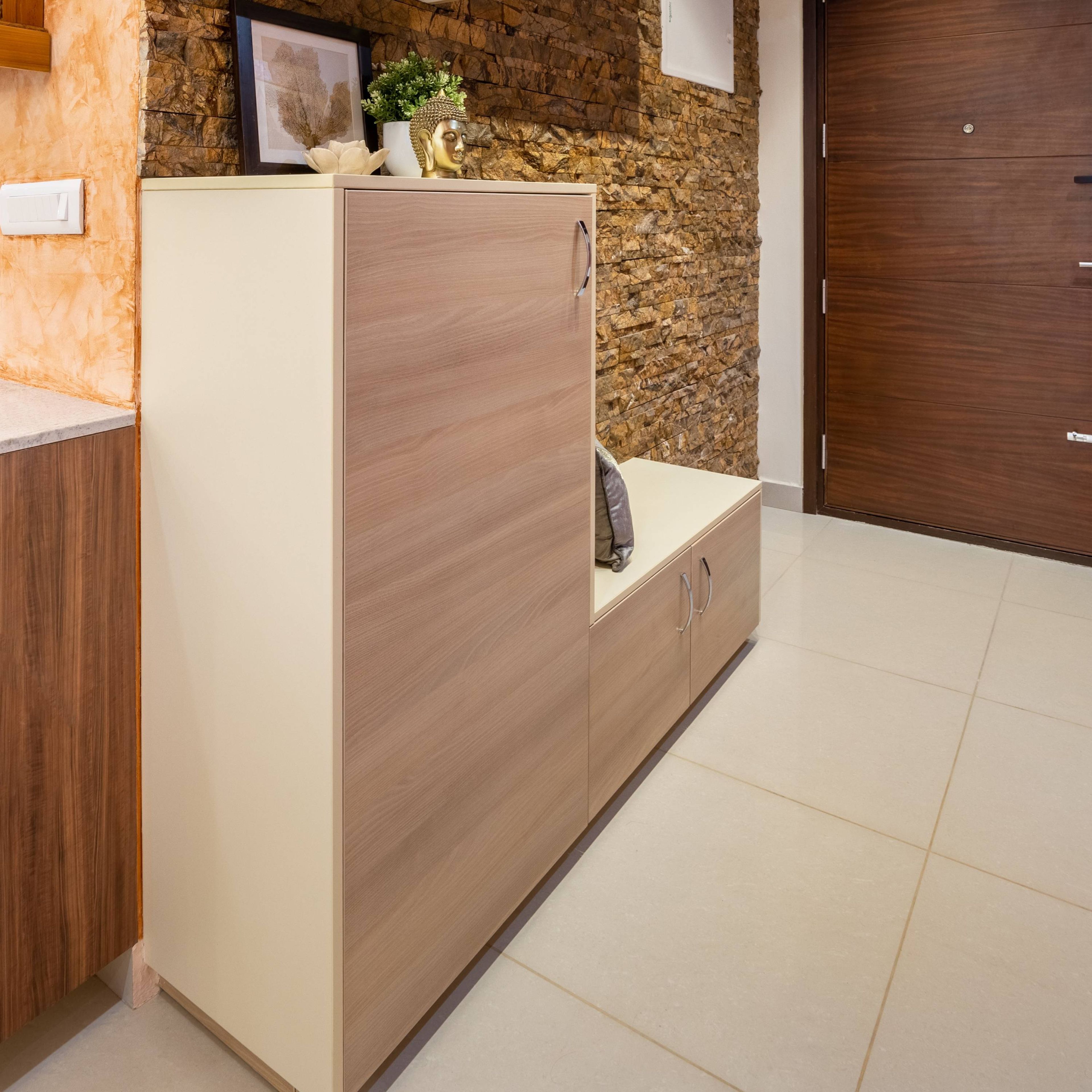 Compact Foyer Design With Stone Brick Accent Wall