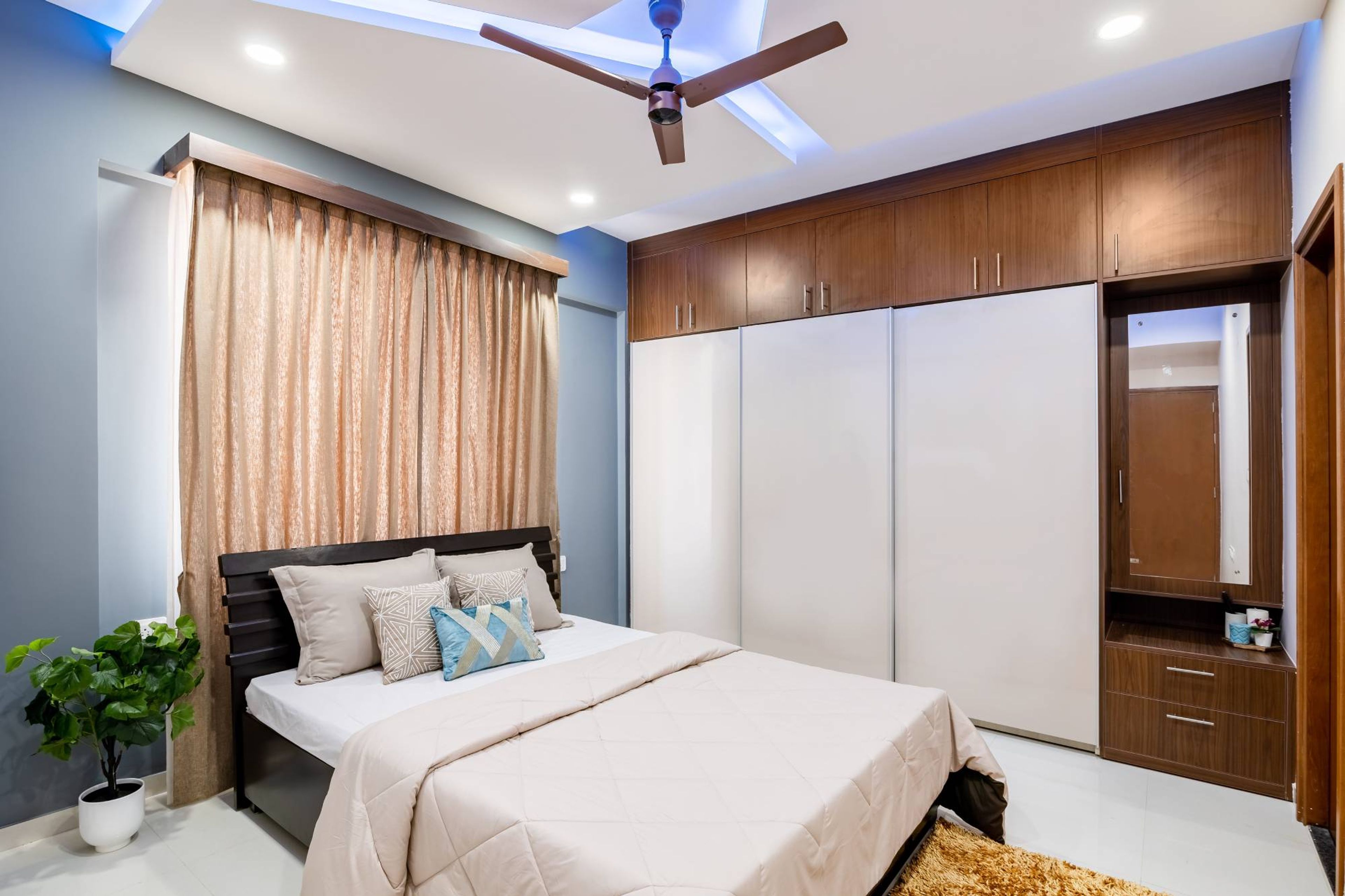 Modern Guest Bedroom Design With White And Walnut Wardrobe