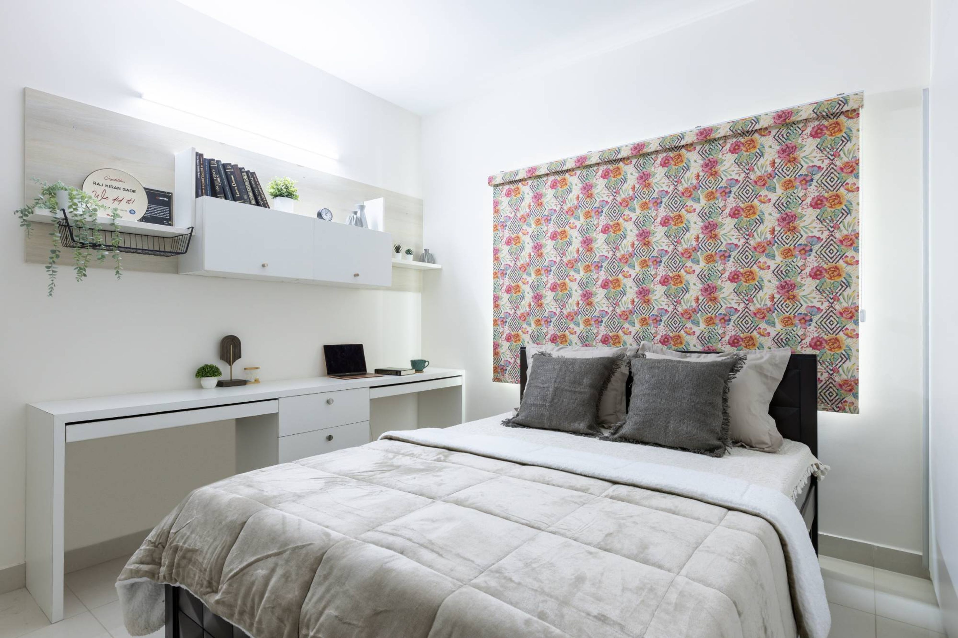 Modern Guest Bedrom Design With Patterned Accent Wall And Study Table