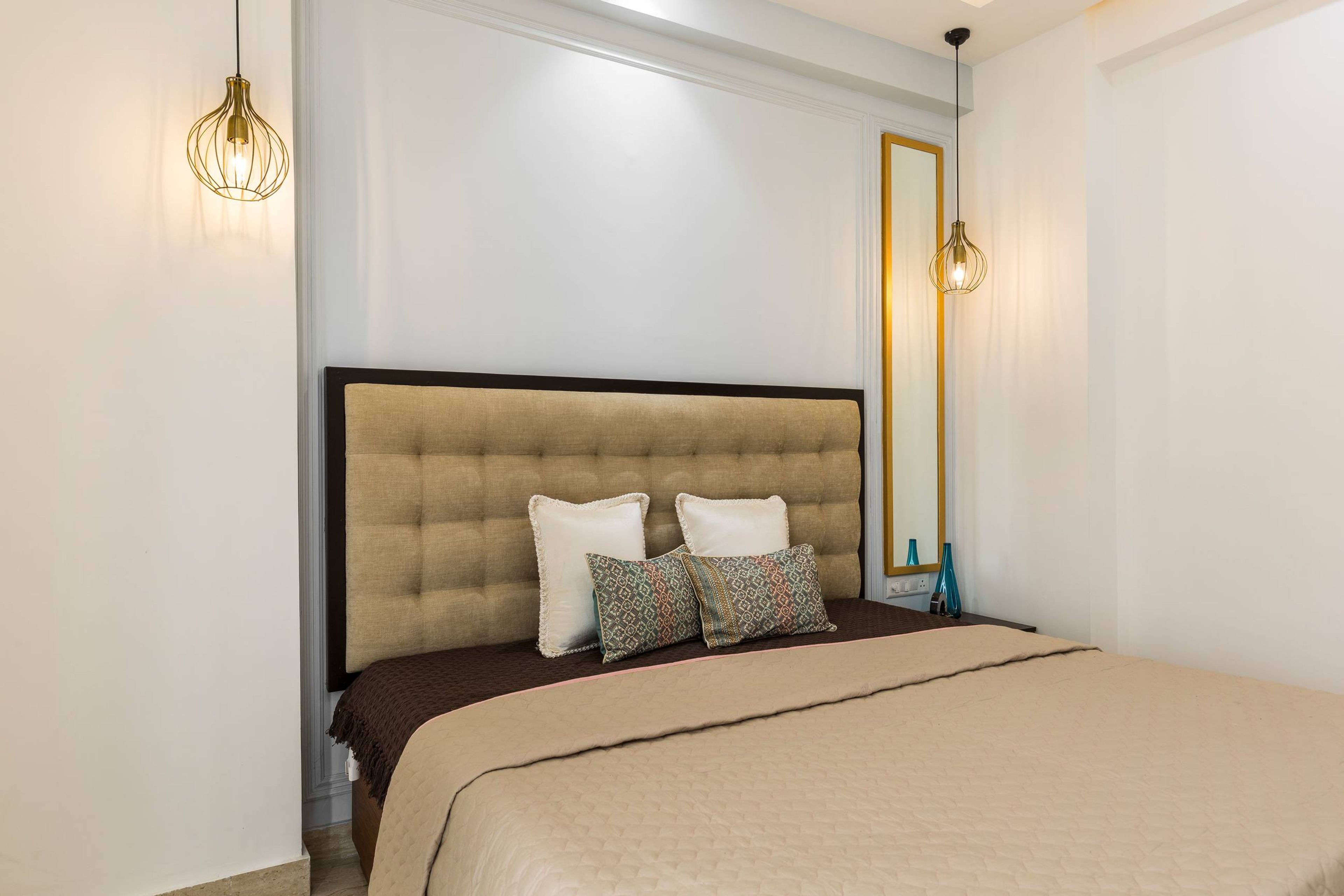 Modern Guest Room Design With Linen White Wall Design And Hanging Lights