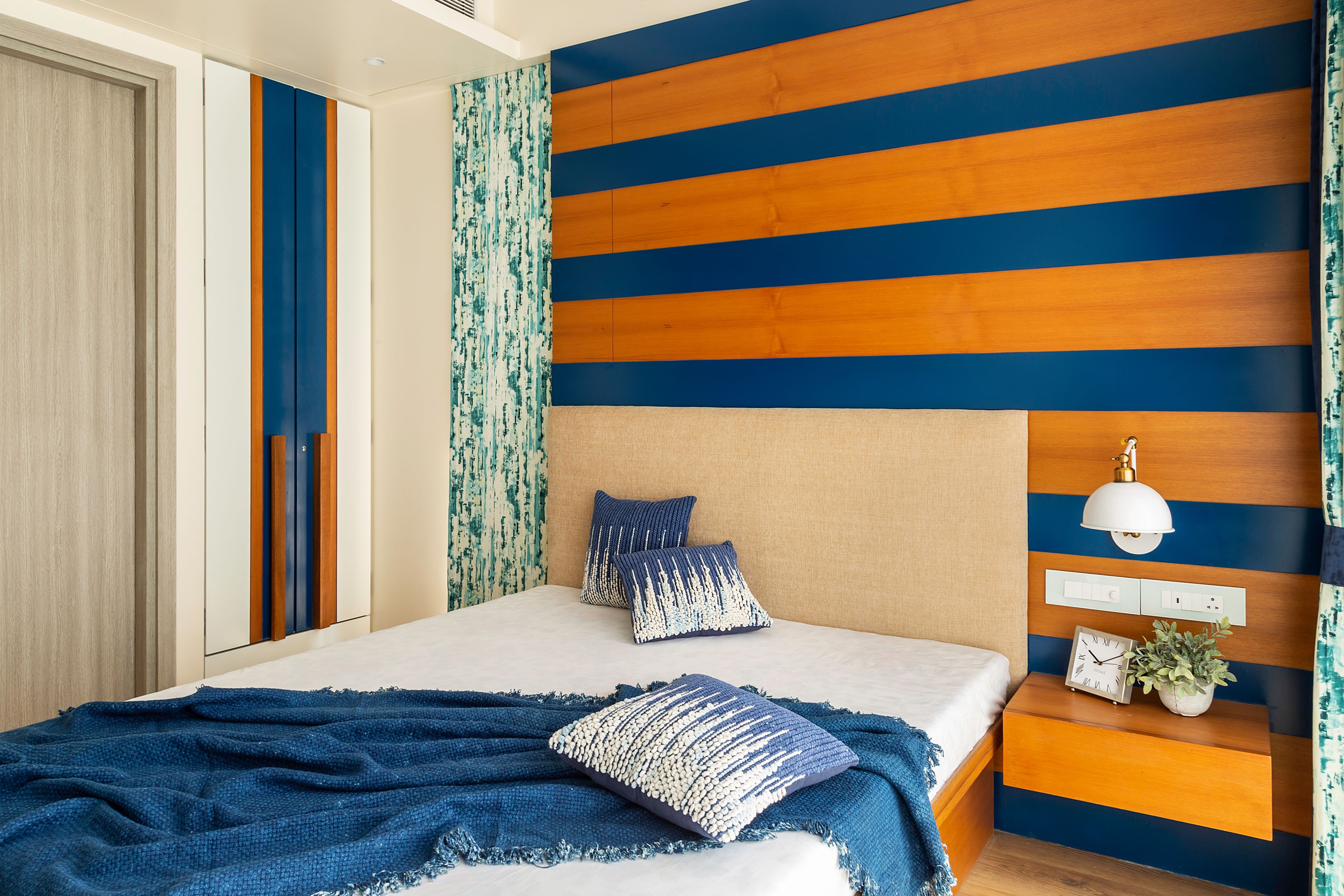 Contemporary Guest Bedroom Design With Blue And Walnut Toned Interiors