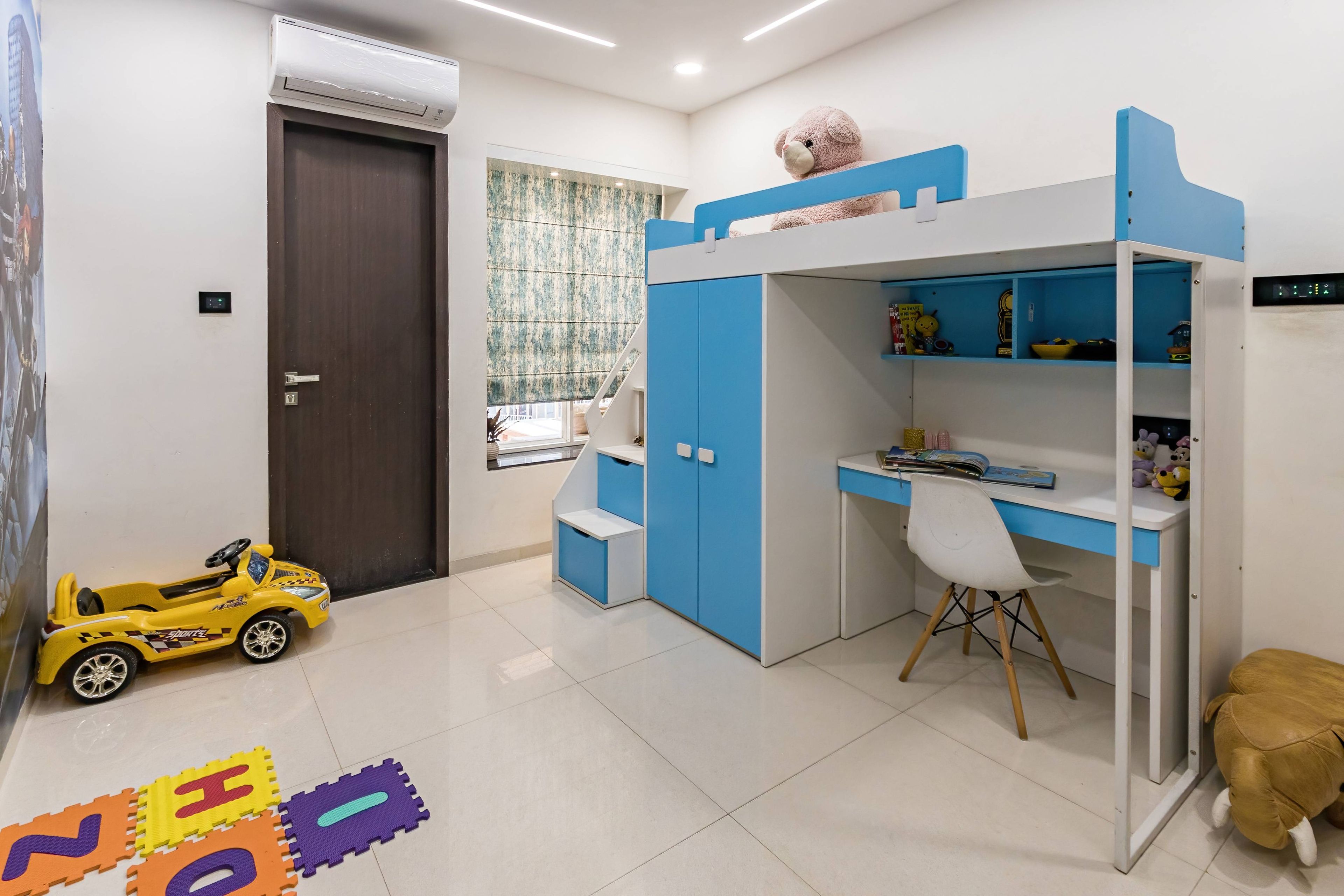 Modern Kids Room With  Blue And Grey Bunk Bed And Study Unit