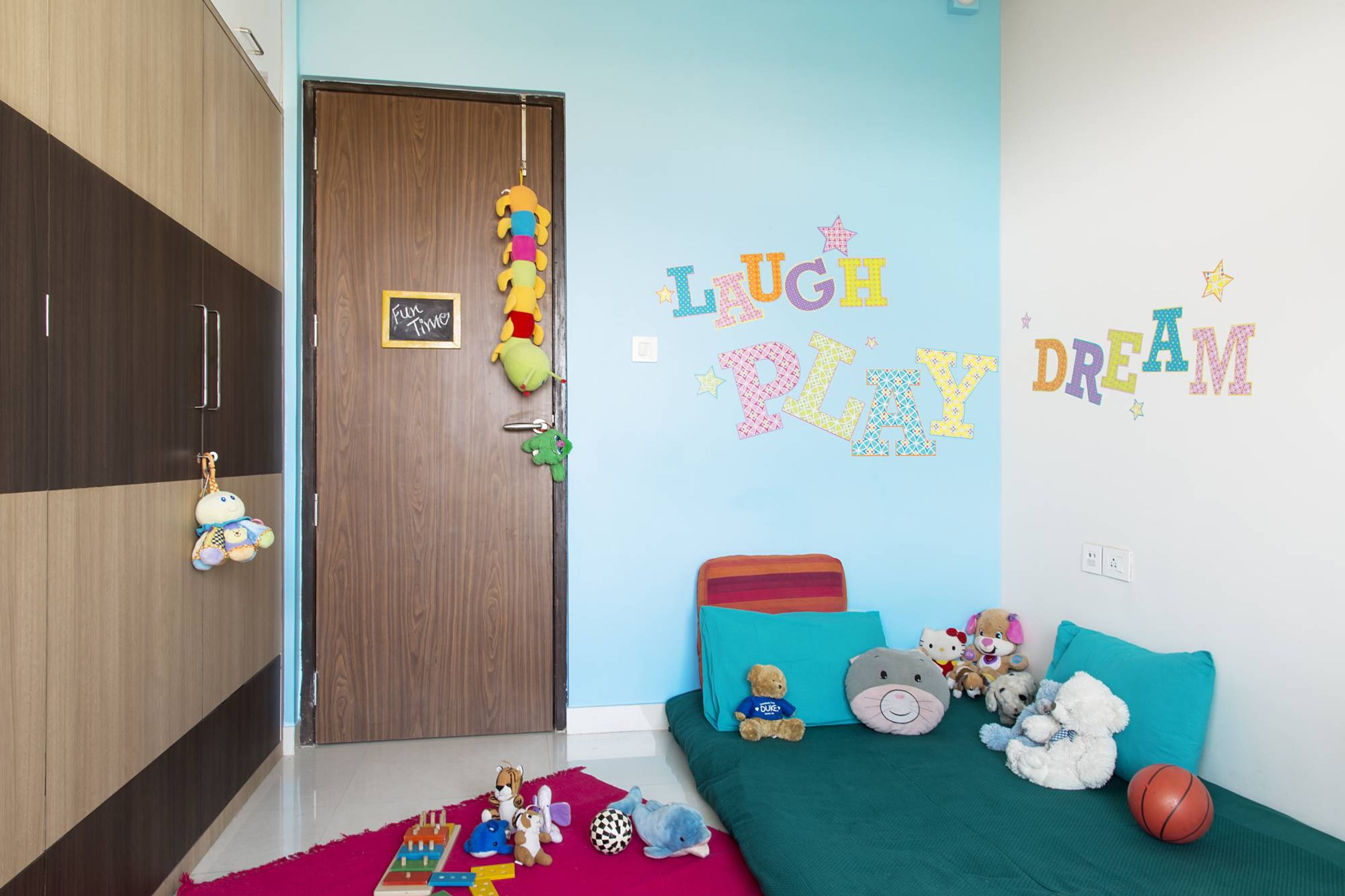 Modern Kids Room Design With A Daybed And Wooden Wardrobe