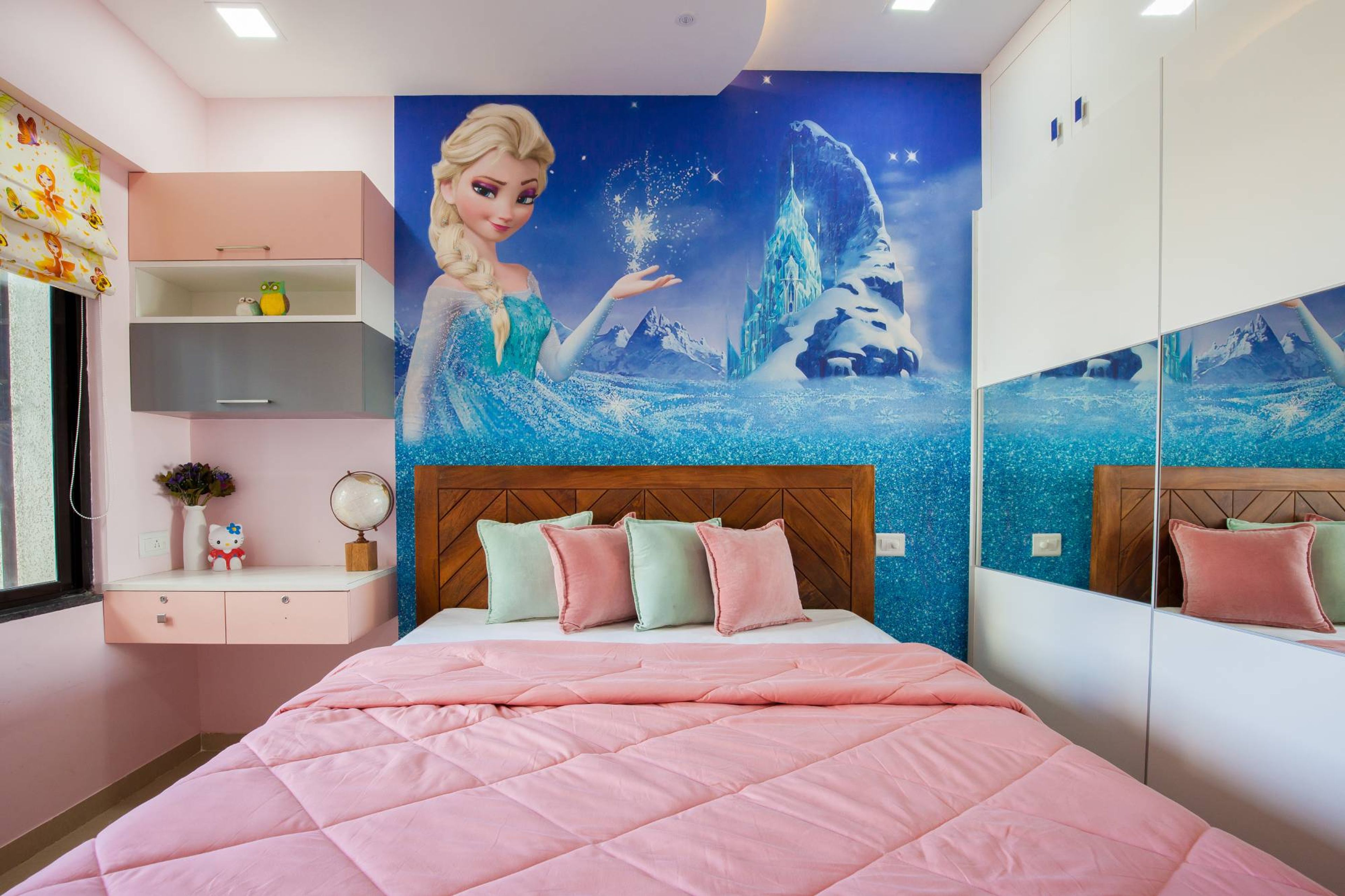 Modern Kids Room With Pink Shelves And Frozen Movie-Themed Wallpaper