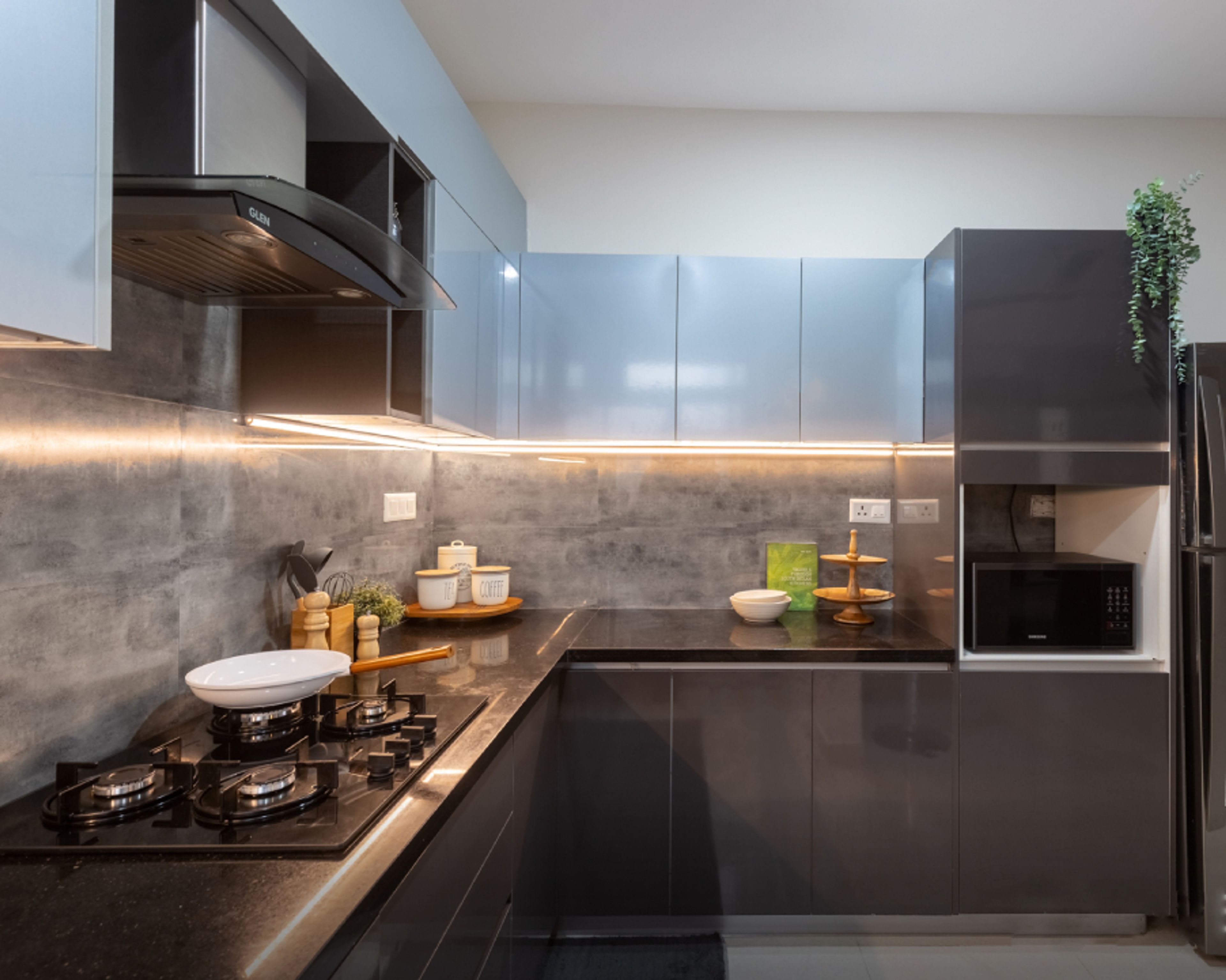 L-Shaped Kitchen With A Grey Backsplash - Livspace