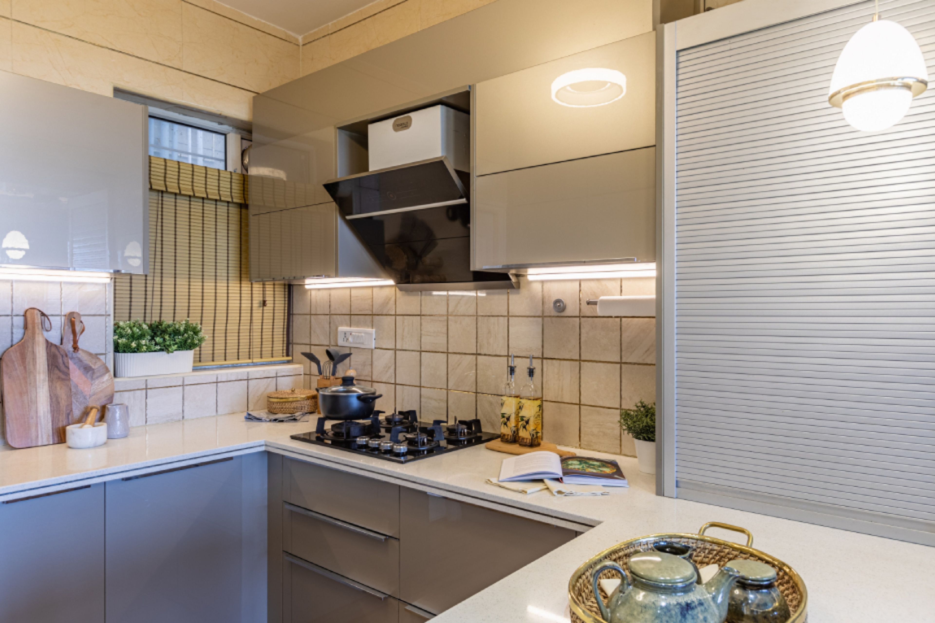 Modern U-Shaped Kitchen Design With A Corian Countertop