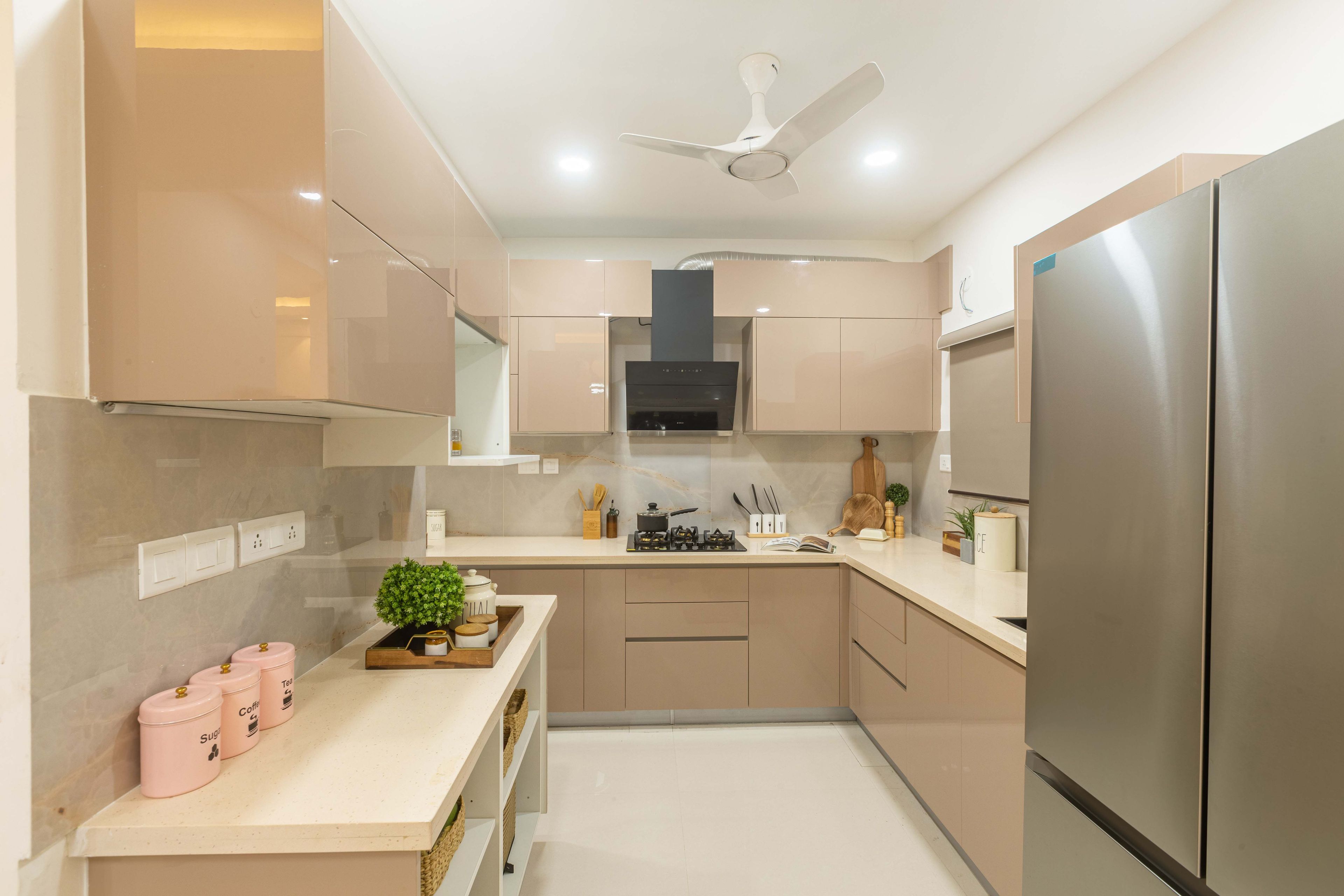 Modern L-Shaped Kitchen Design With Metallic Beige Cabinets
