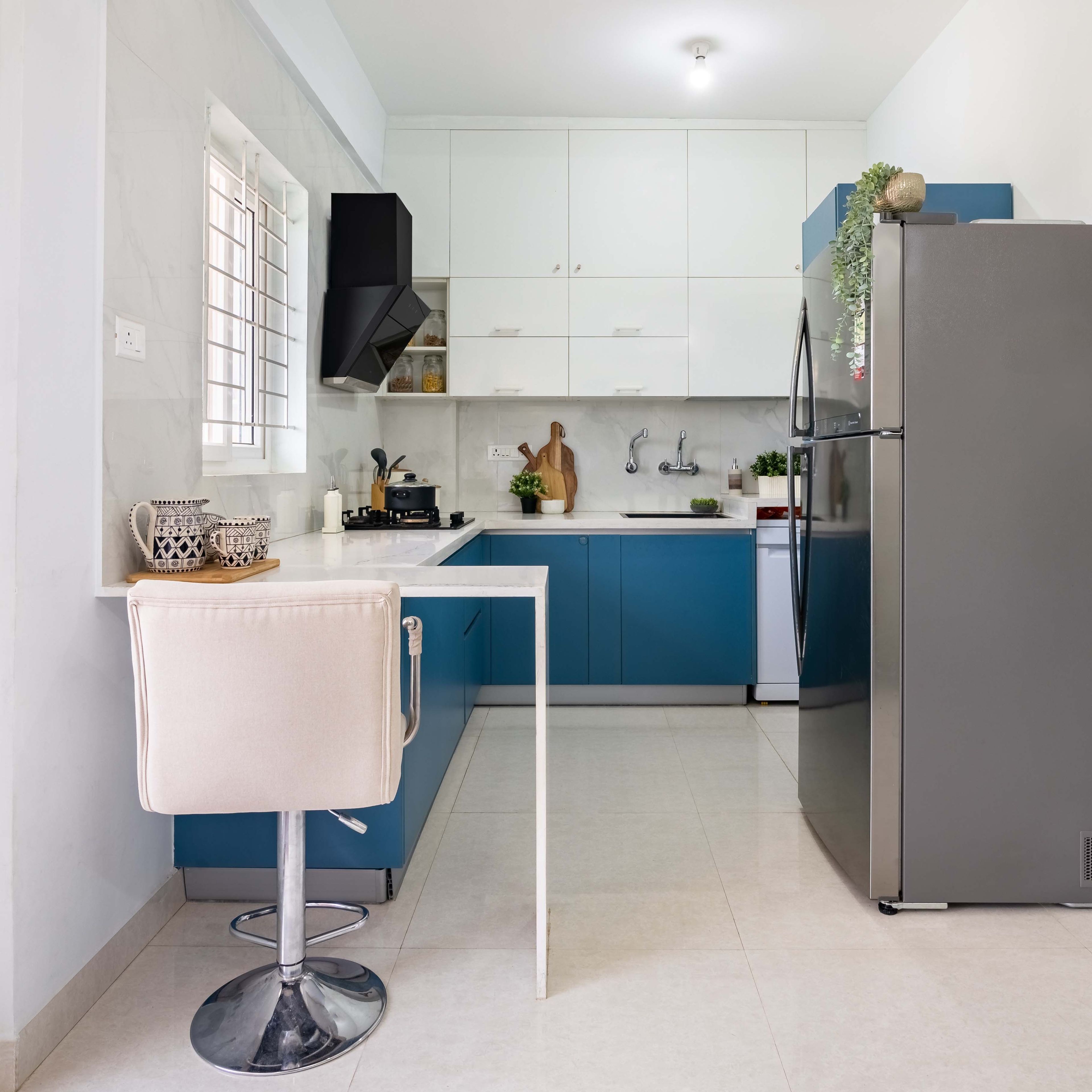 Modern L-Shaped Kitchen Design With Blue And White Storage Units