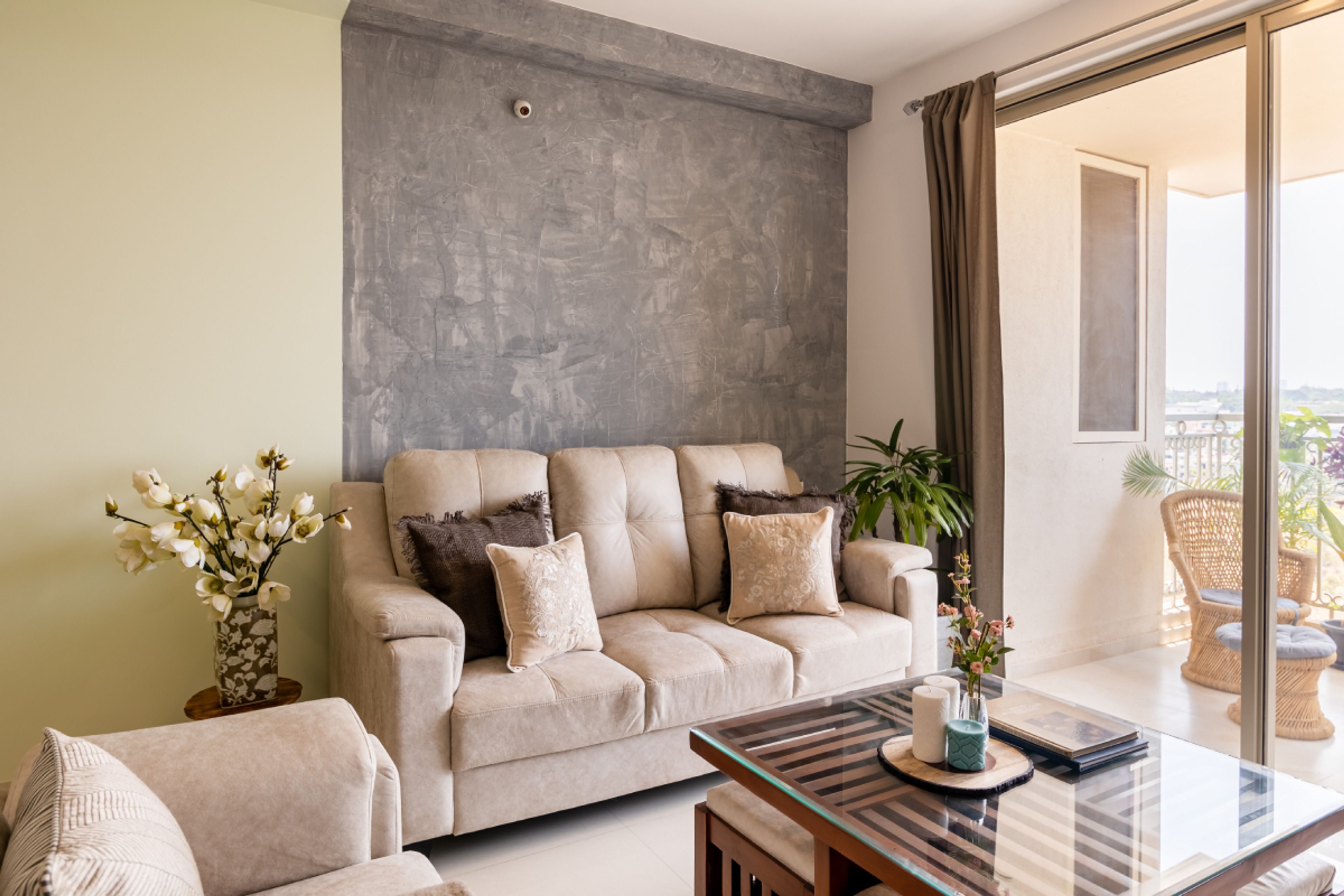 Modern Living Room With 3-Seater Cream Upholstered Sofa And Wooden Center Table - Livspace