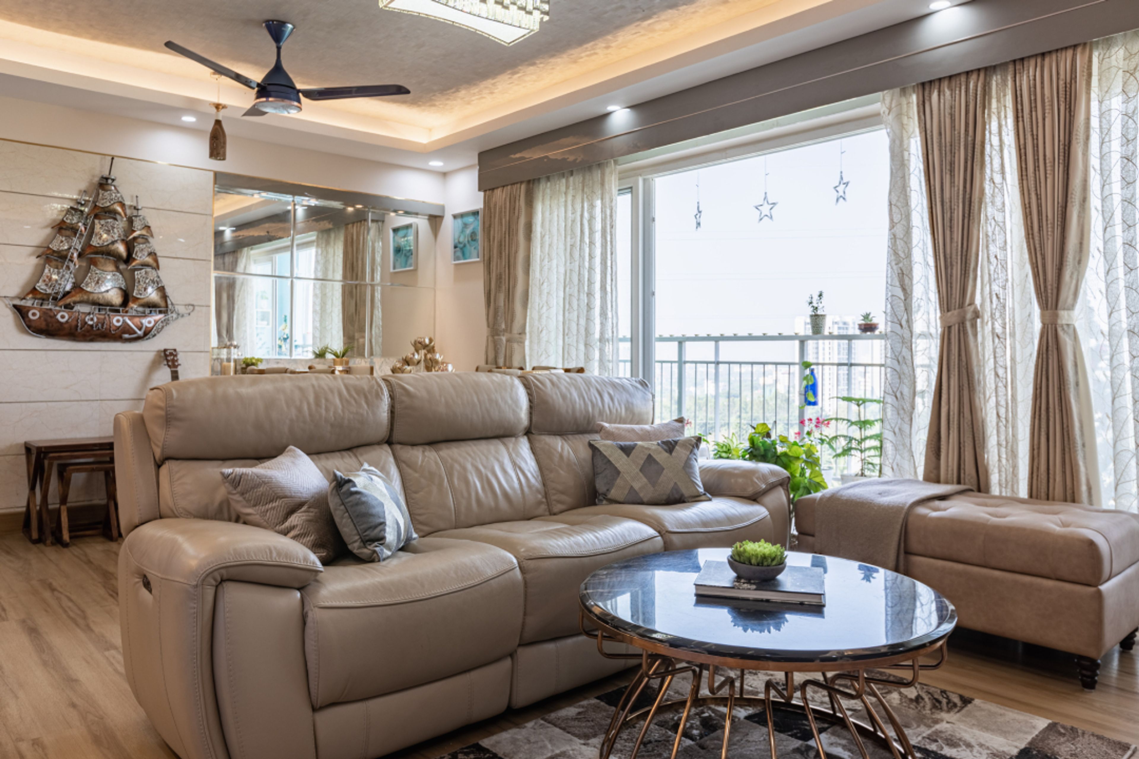 Living Room With Leather Recliners And An Upholstered Ottoman For Comfortable Seating - Livspace