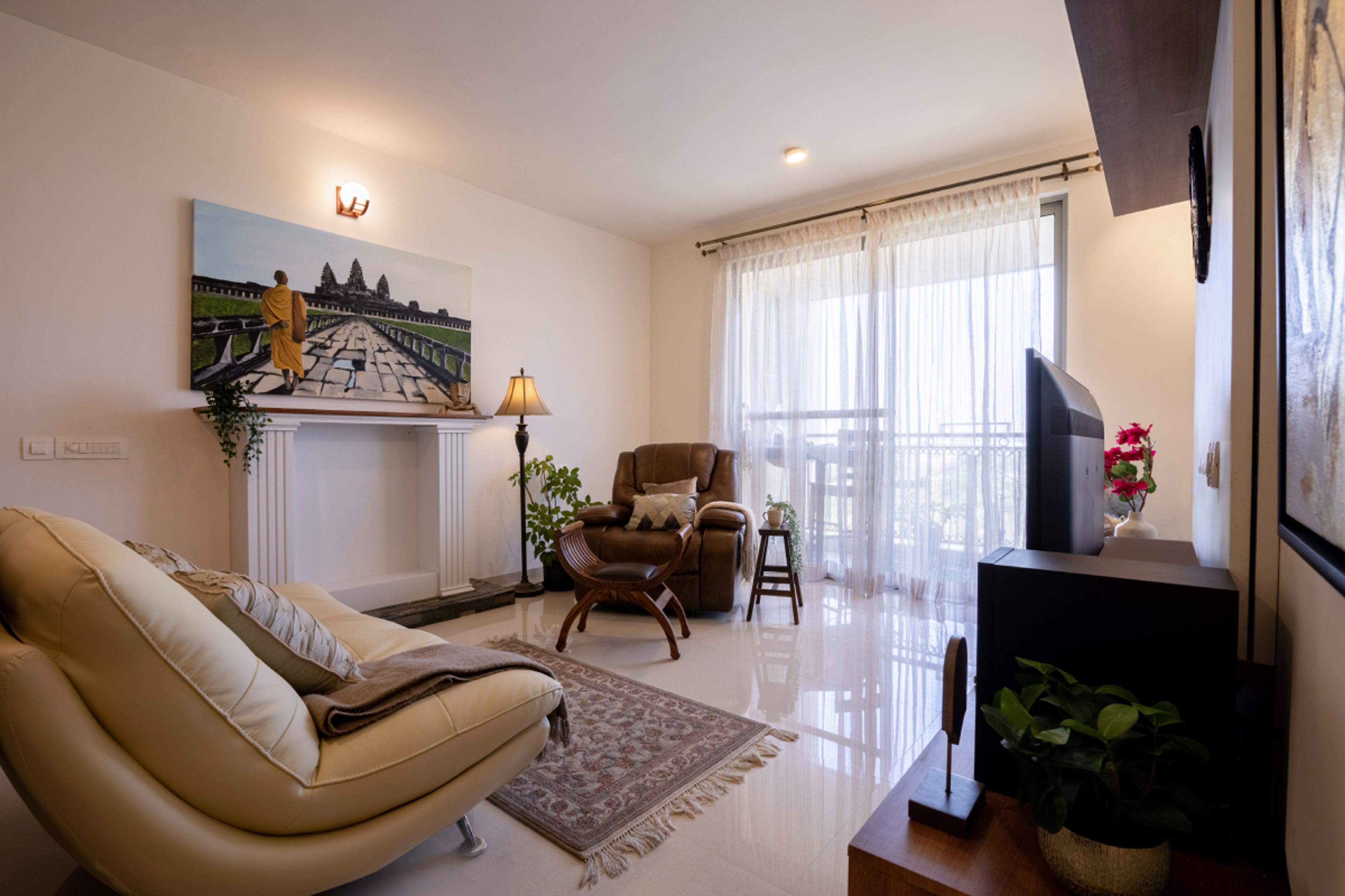 Living Room With Colourful Wall Art And 2-Seater Yellow Sofa - Livspace