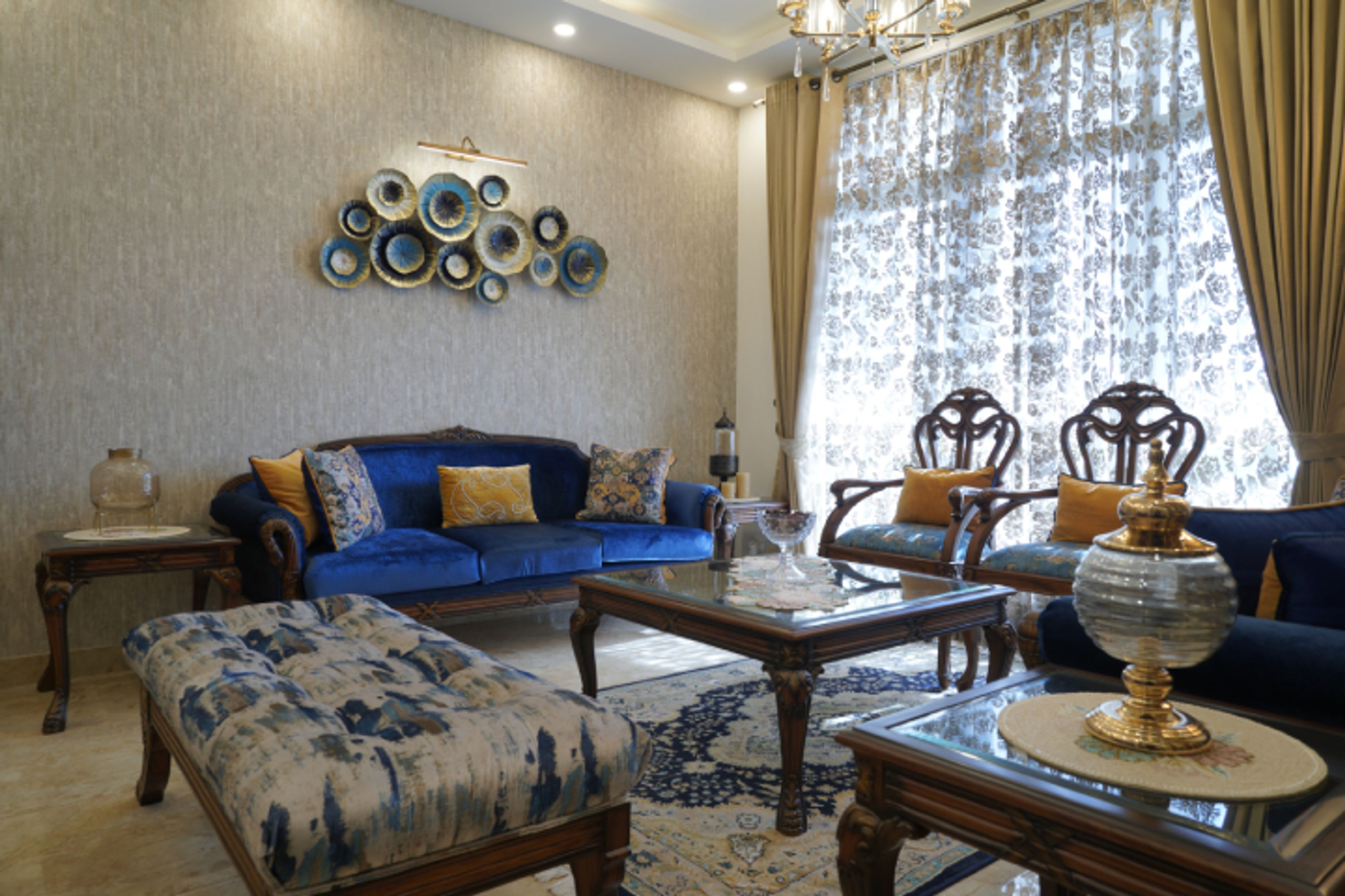 Living Room With 2 Traditional Sofas And 2 Wooden Chairs With Cushioning - Livspace