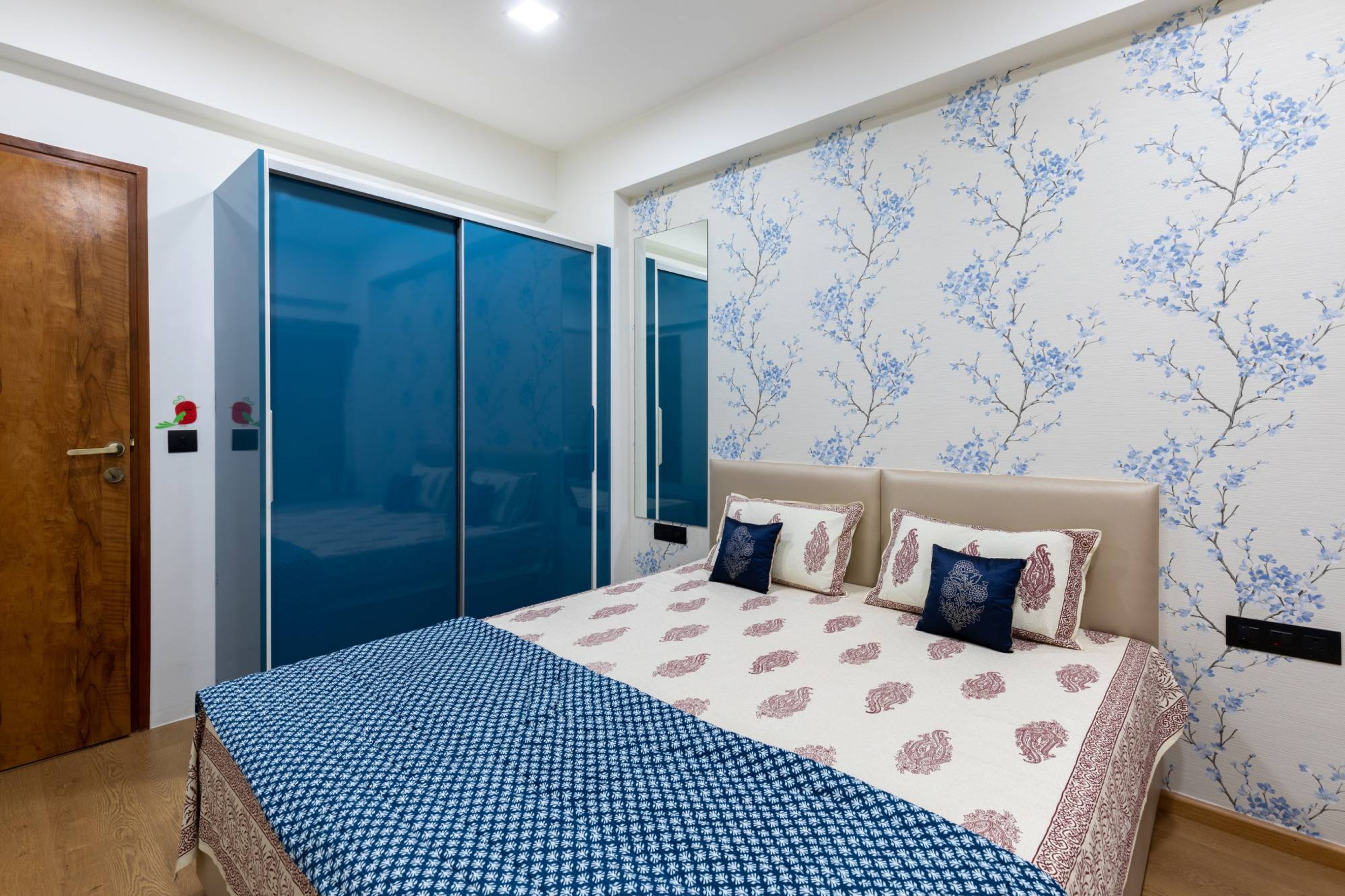 Bedroom Design With A King Size Bed And Sliding Wardrobe - Livspace