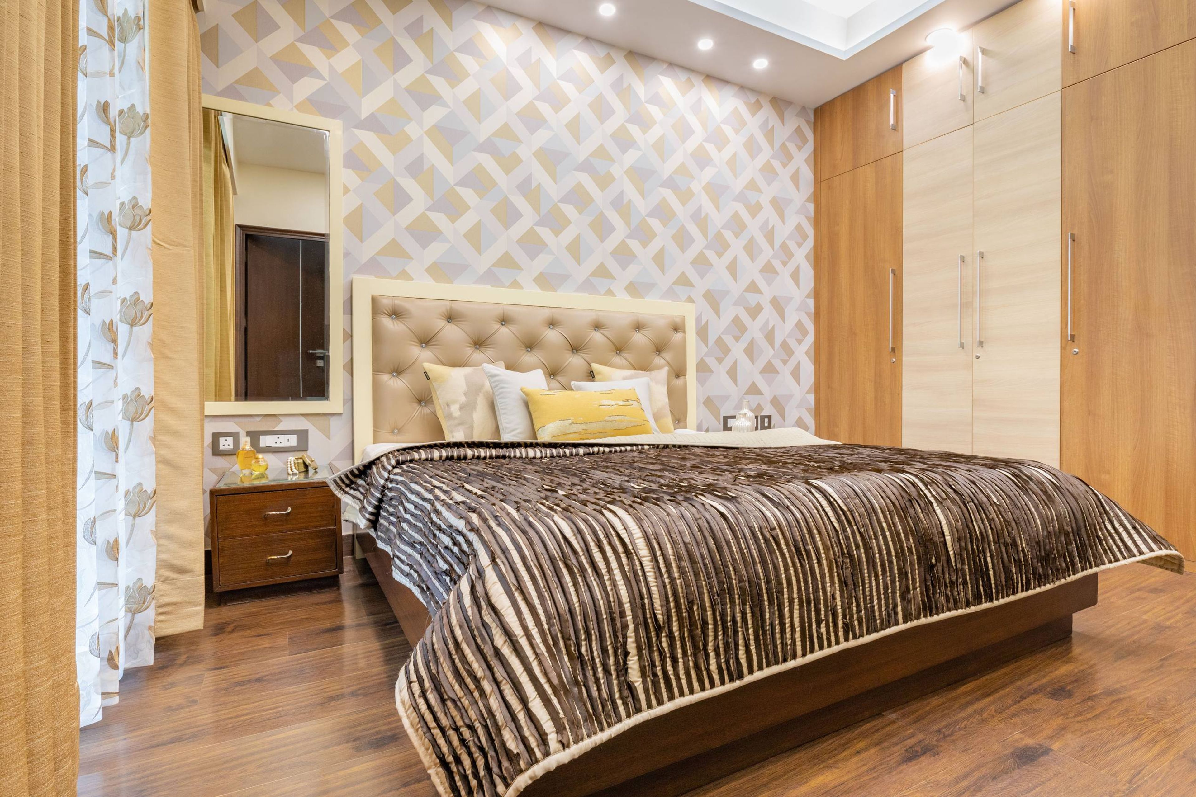 Contemporary Bedroom Design With A King Size Bed With Tufted Headboard And Side Tables