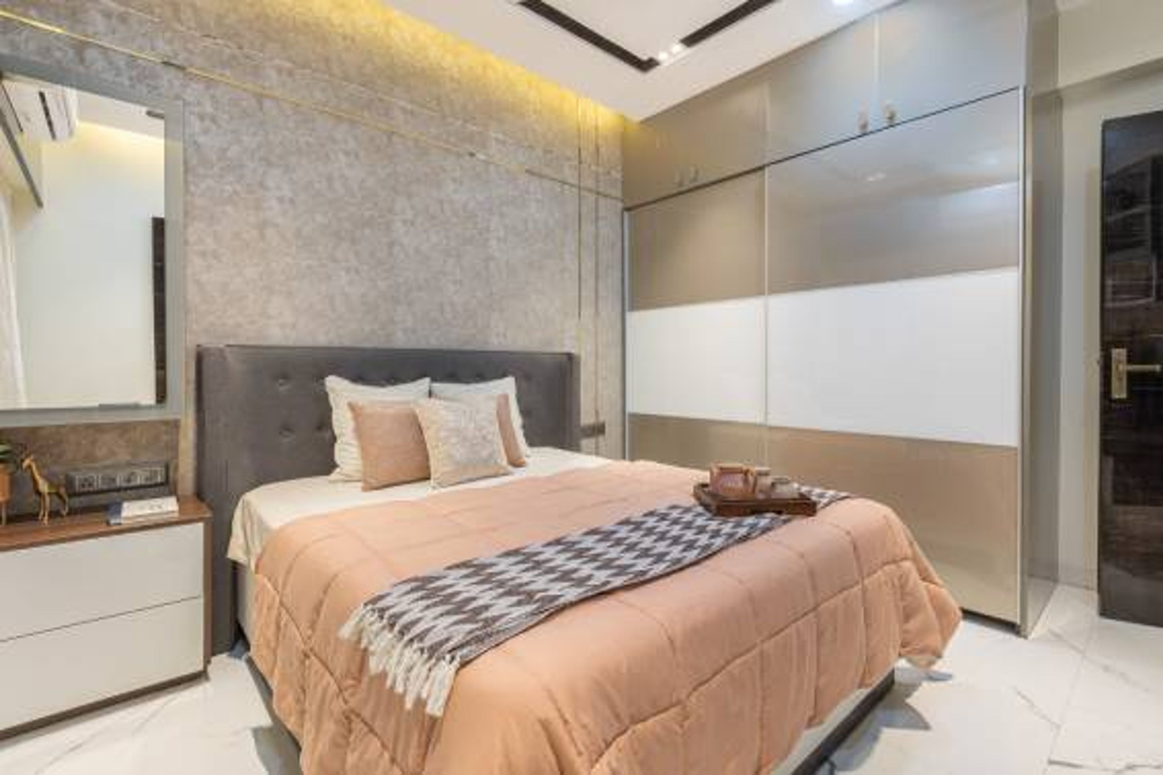 Bedroom Design With A Double Bed With A Grey Tufted Headboard - Livspace