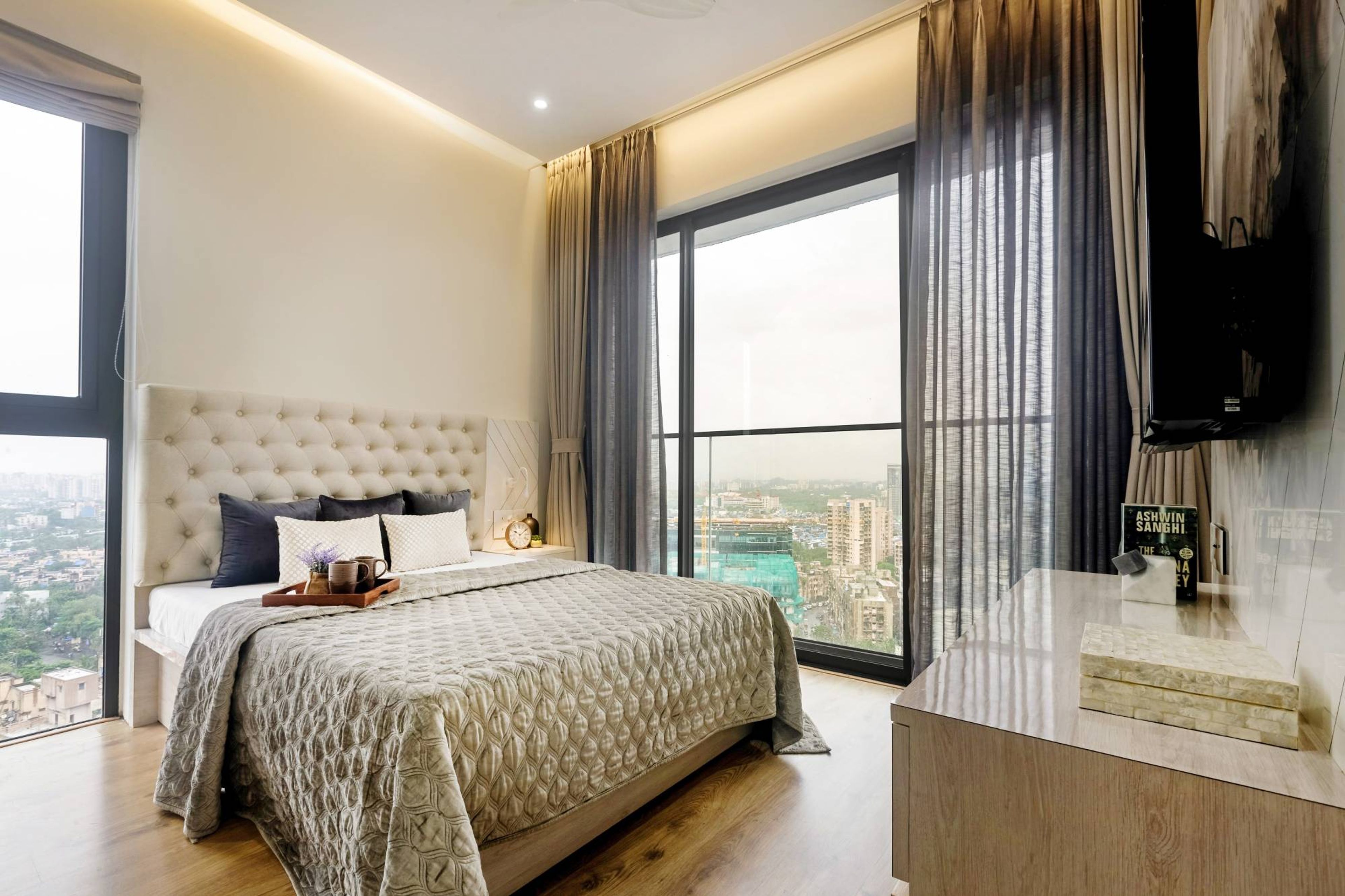 Bedroom Design With A King Size Bed And White Side Table - Livspace