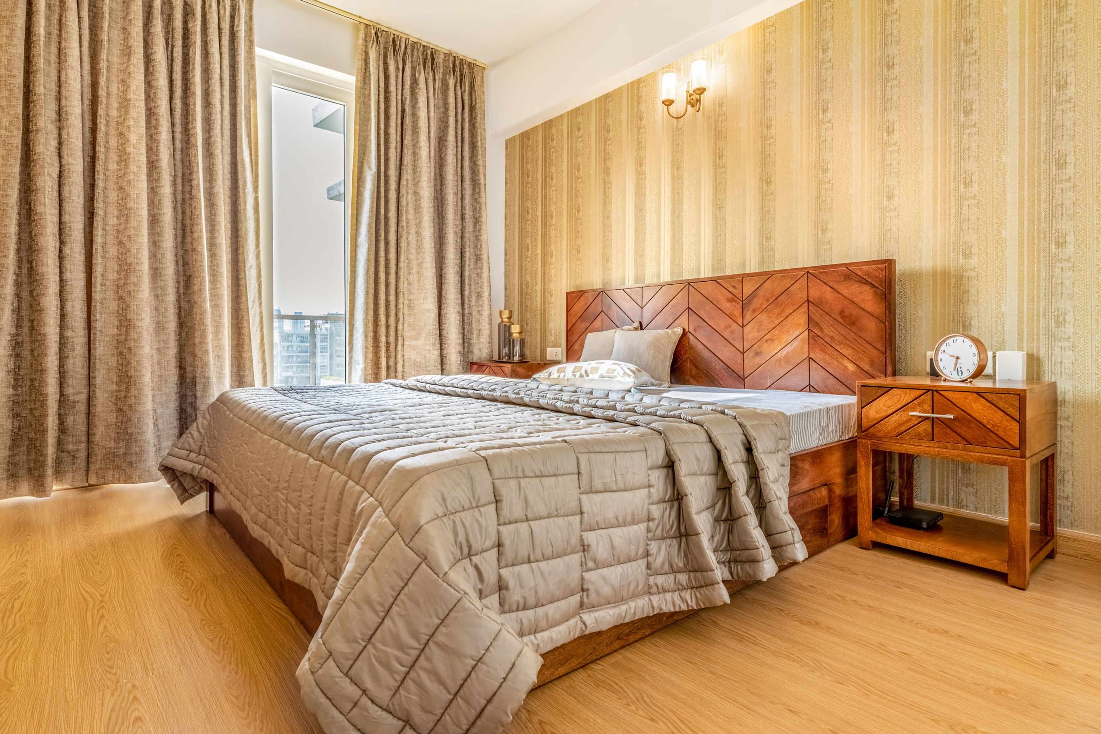 Contemporary Bedroom Design With A Wooden King Size Bed And Large Windows