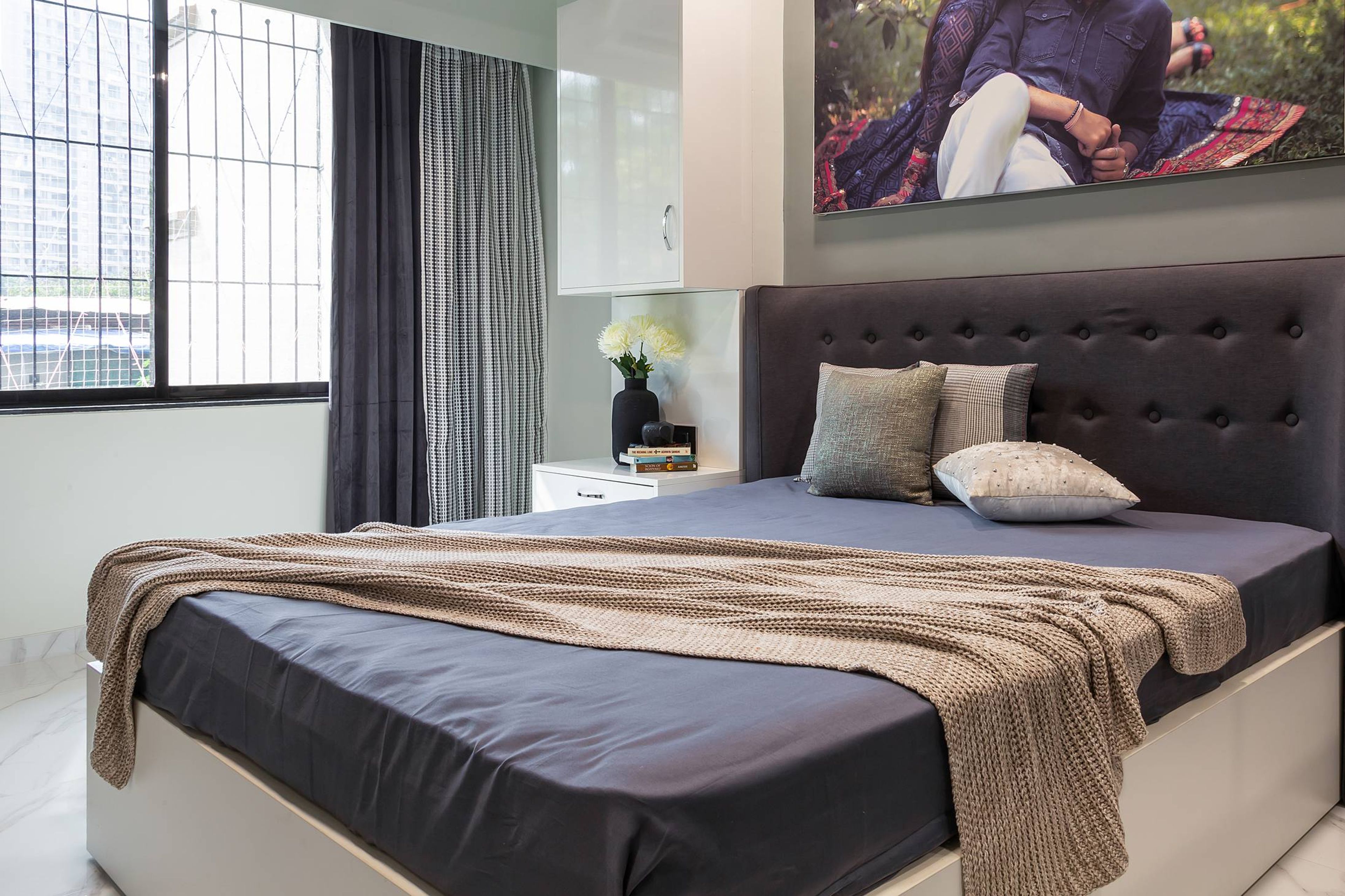 Bedroom Design With White Double Bed And A Sliding Wardrobe- Livspace