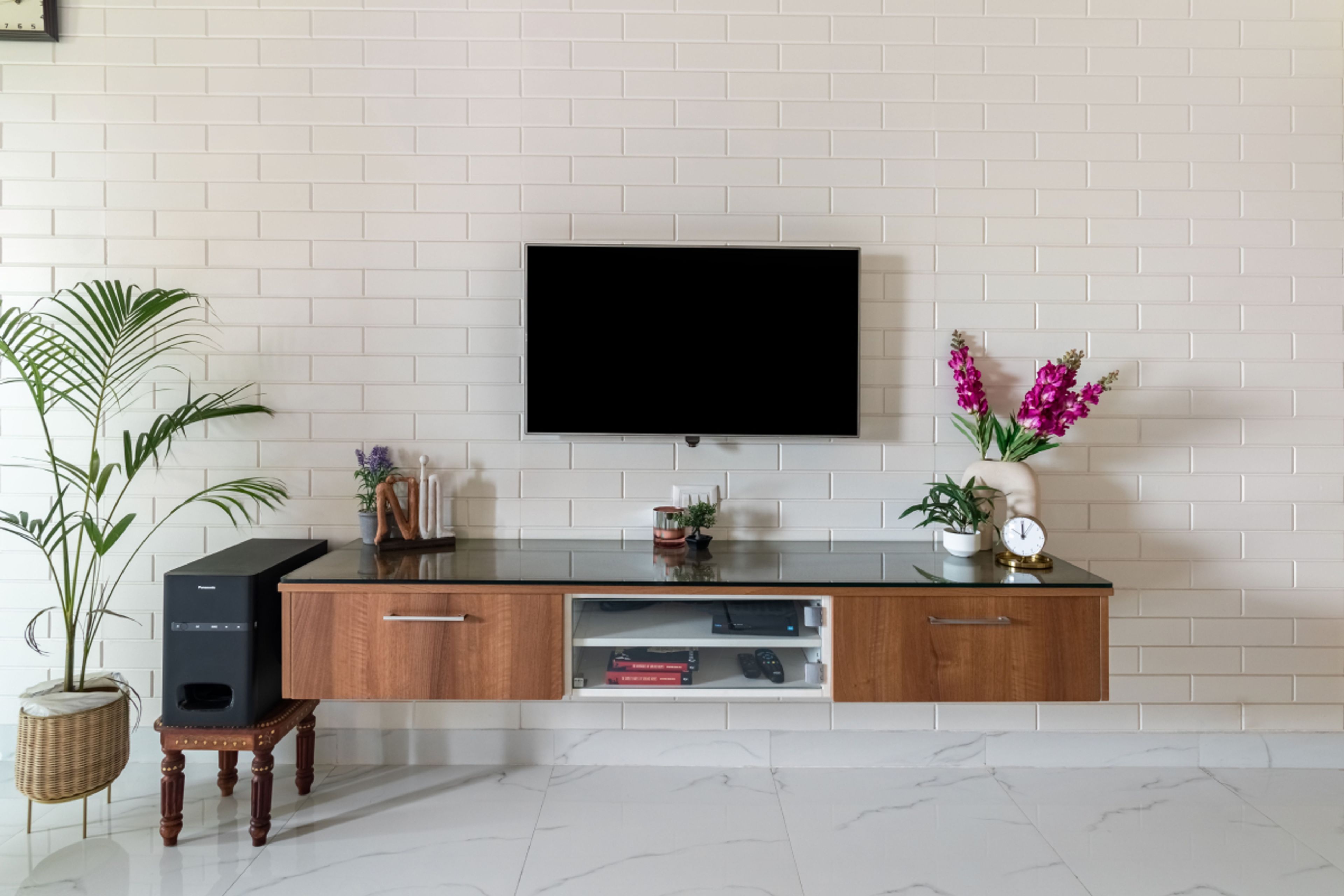 TV Unit Design With White Brick Wall - Livspace
