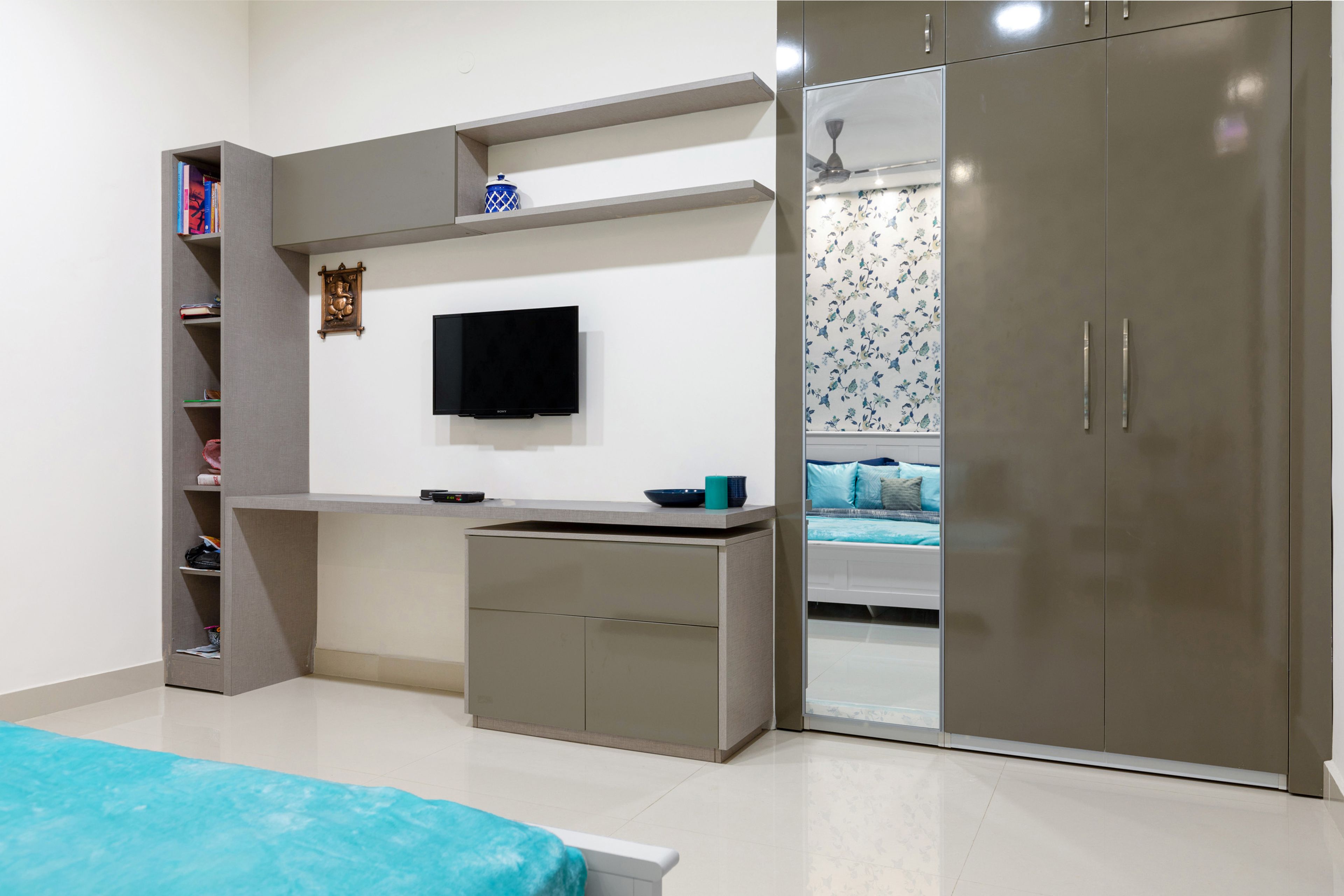 Guest Bedroom With Brown 2-Door Swing Wardrobe And Brown Study Table With TV - Livspace