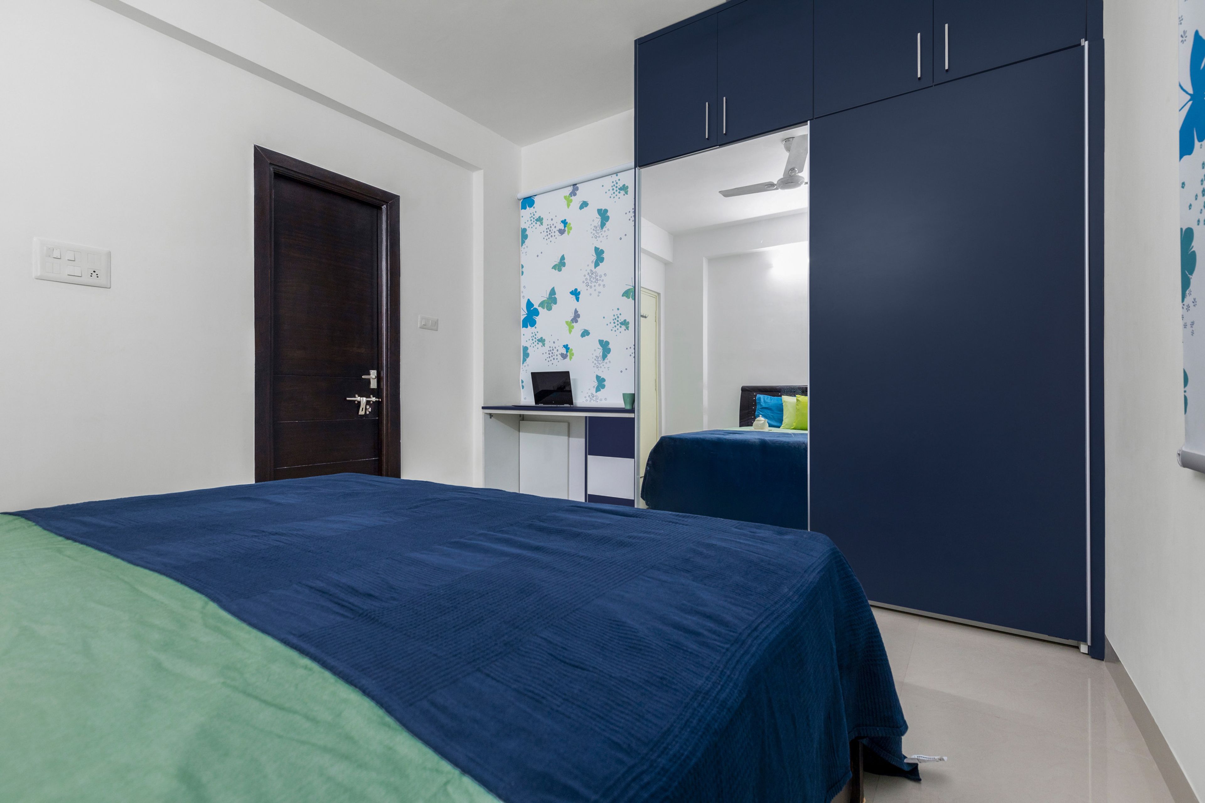 2-Door Blue Sliding Wardrobe With Mirror And Integrated Wall-Mounted Study Unit - Livspace