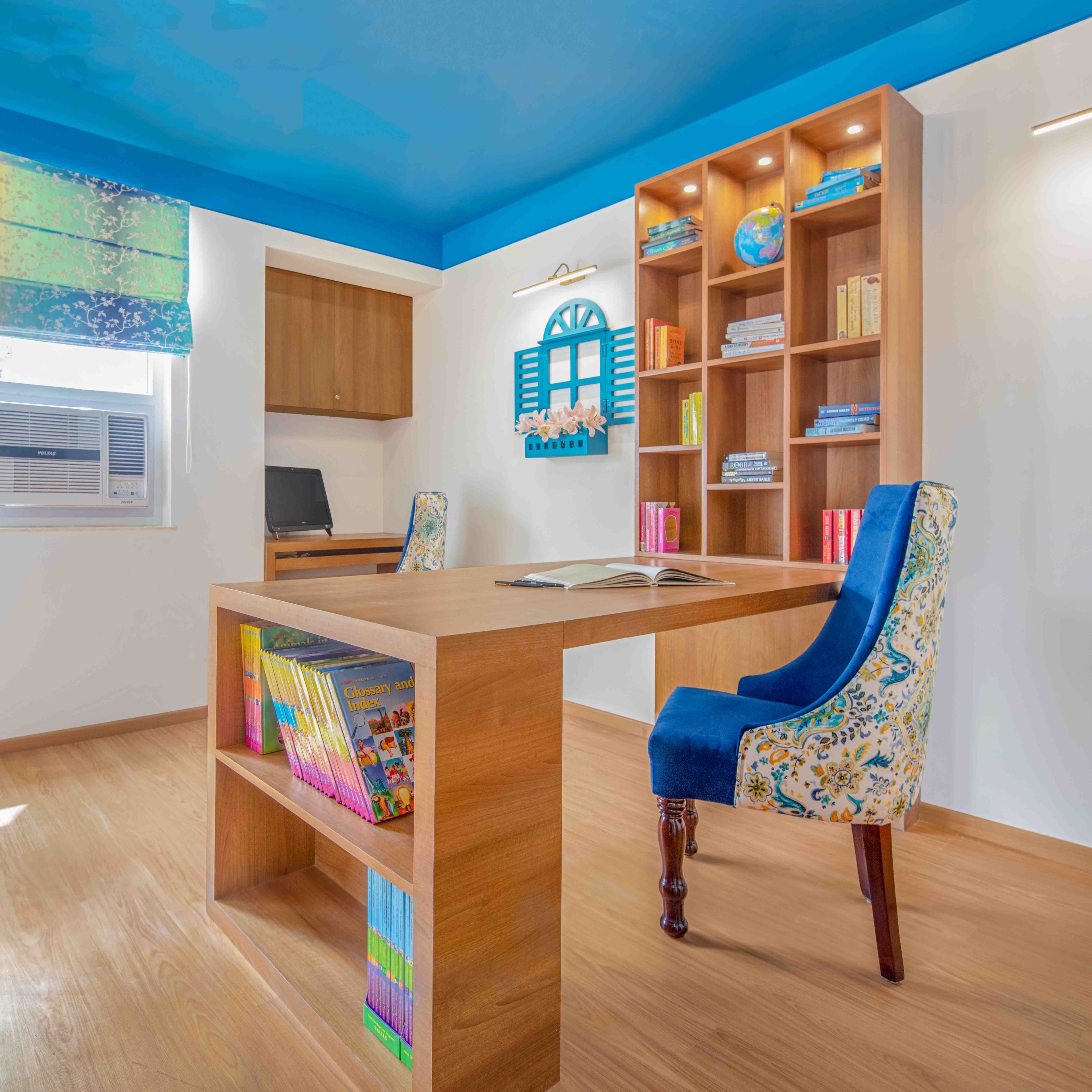 Wooden And Blue Home Office Design With Printed Accent Chair And Open Shelf Unit - Livspace