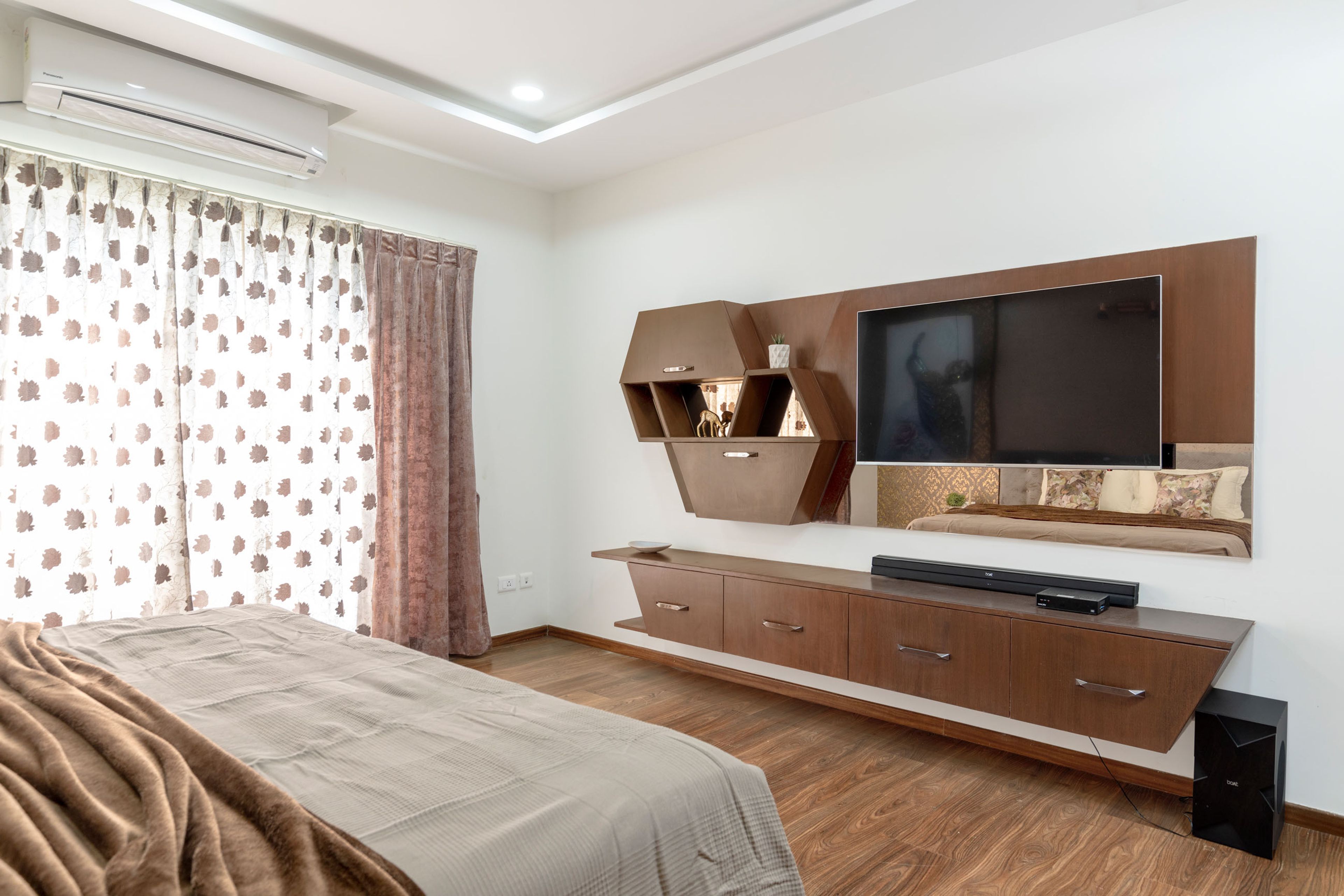 Wall-mounted wooden TV unit design - Livspace