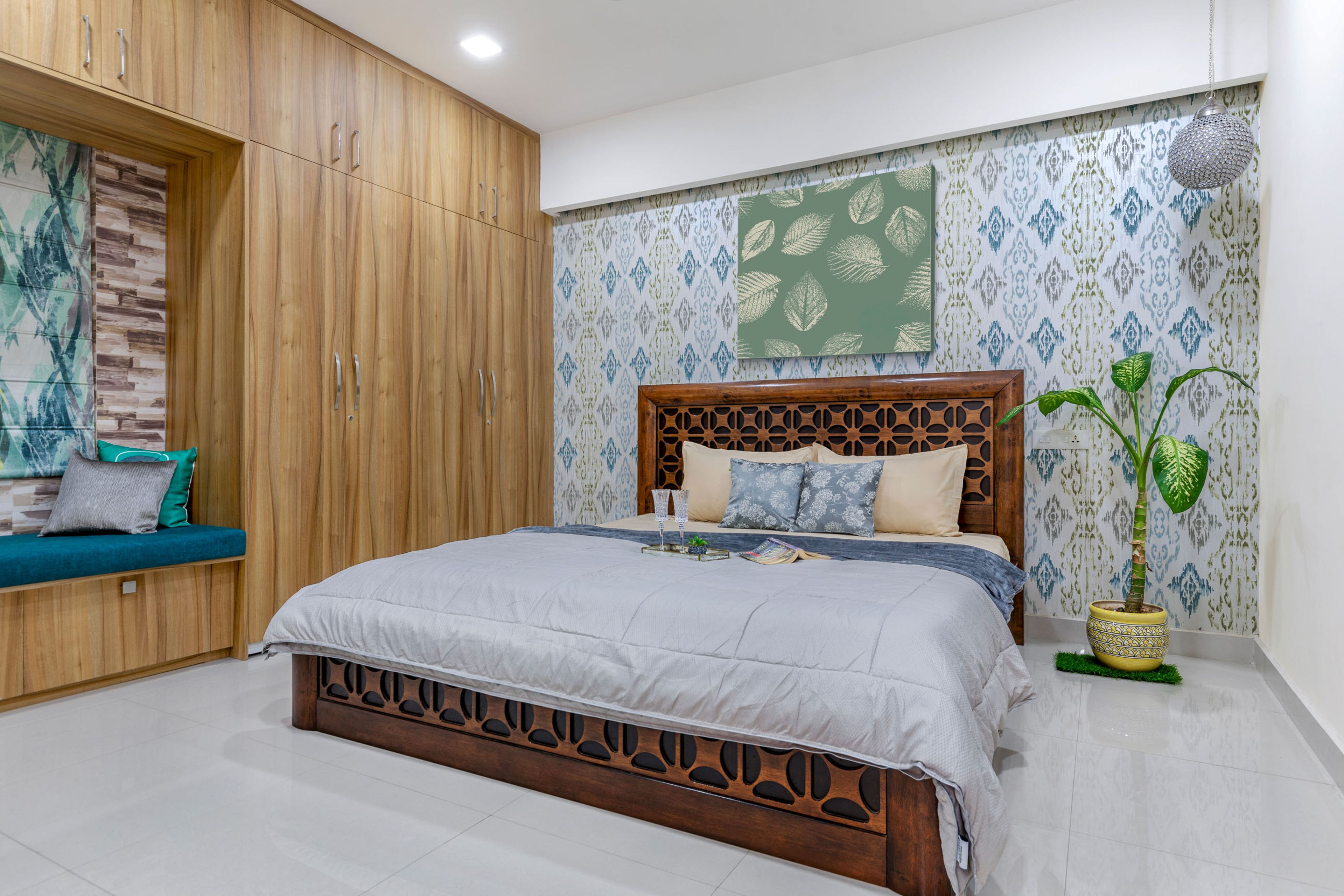 Guest Bedroom With Wooden Bed, 4-Door Wooden Swing Wardrobe Design With Lofts And Seater And Traditional Motif Wallpaper - Livspace