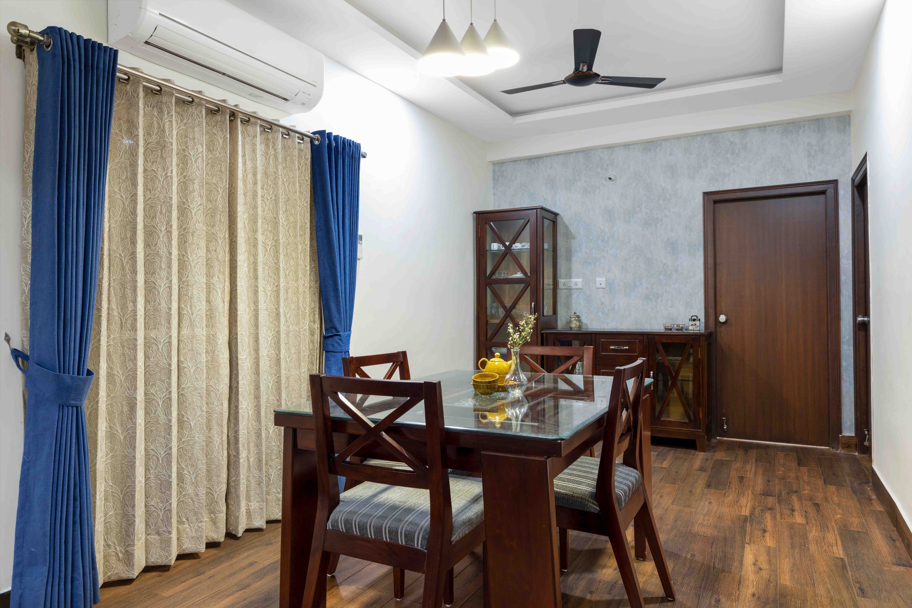 4-Seater Wooden Dining Room Design With Glass Countertop - Livspace